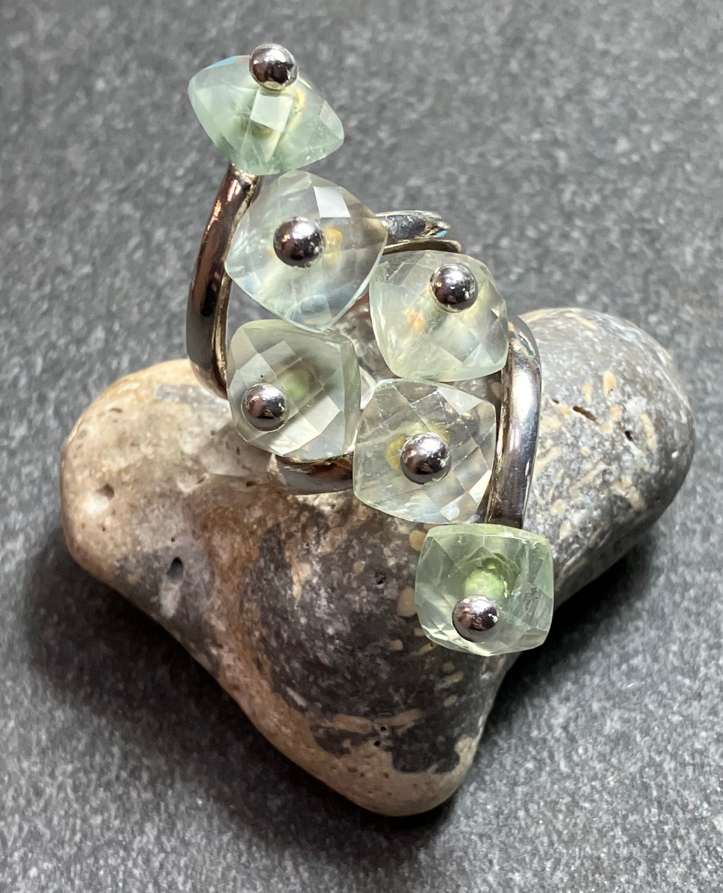 Really unusual vintage sterling silver ring with 6 faceted pale green Prehnite stones.