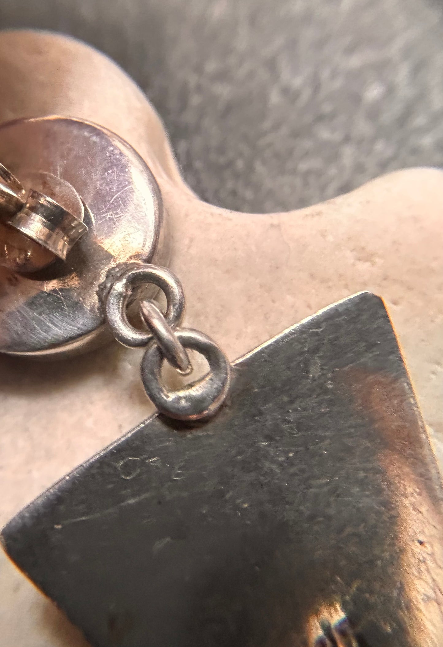 A pair of vintage sterling silver geometric drop earrings with a distinct 1980s aesthetic.