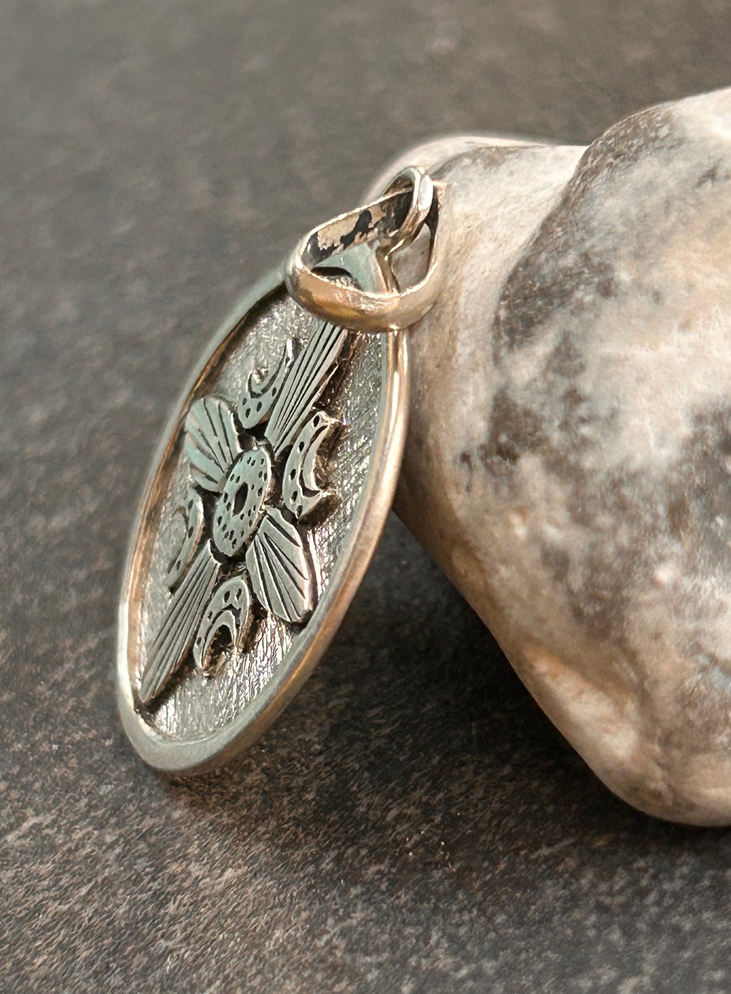 A striking vintage sterling silver circular pendant