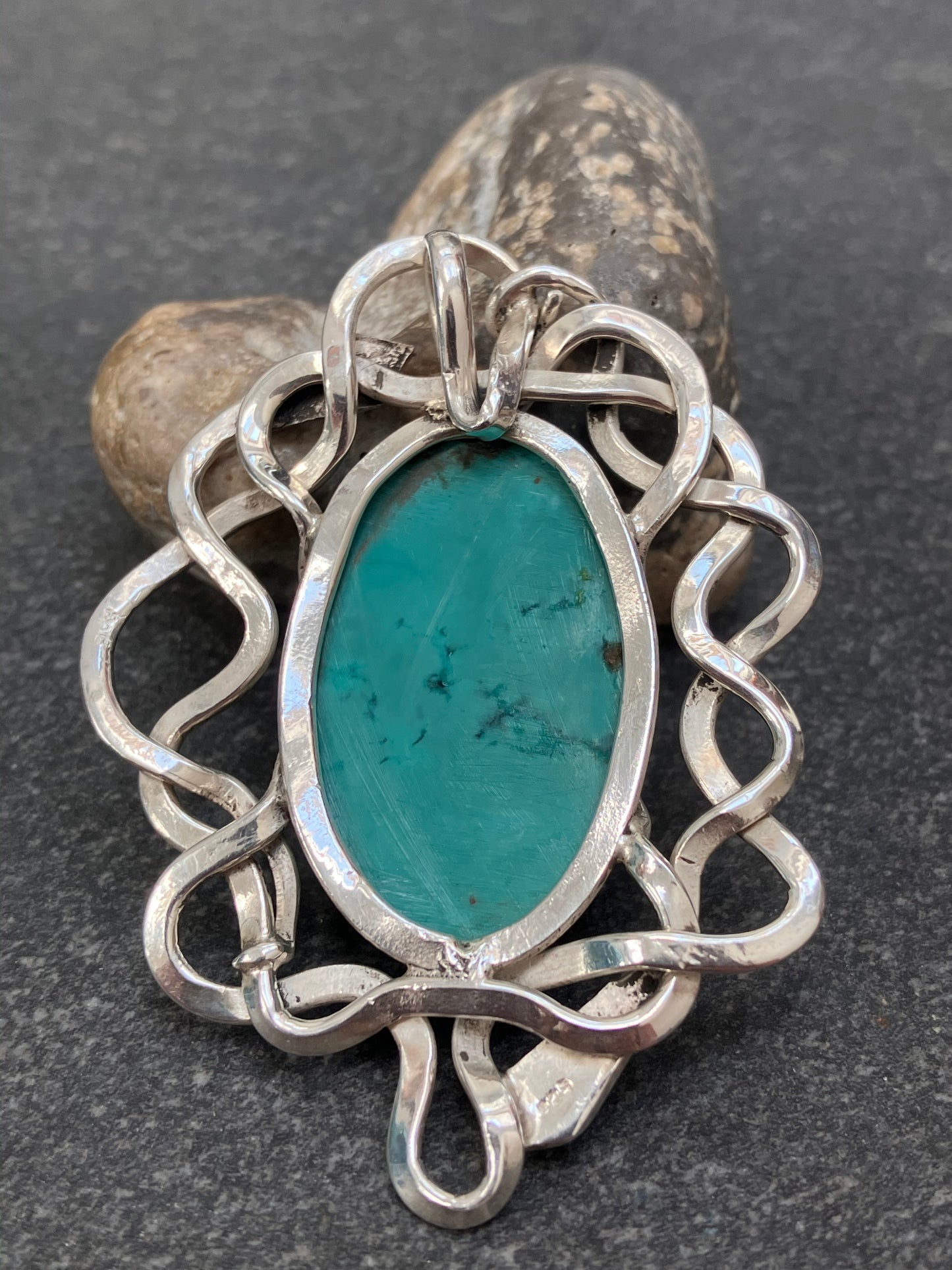 Artisan vintage sterling silver intertwining snake pendant with a piece of Turqurenite in the centre.