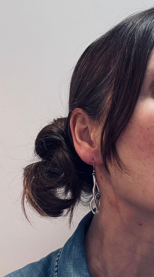 Vintage sterling silver artisan earrings with a graceful organic form.
