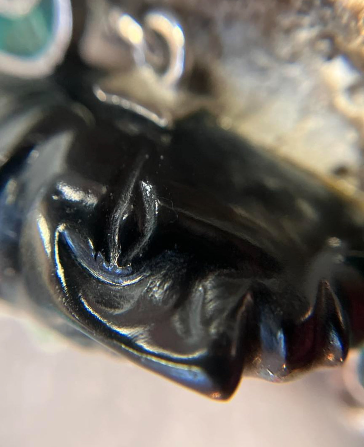 A striking vintage Mexican warrior face pendant crafted in sterling silver.