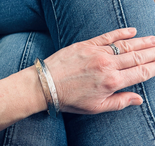 This vintage sterling silver artisan bangle is a one-off piece, alive with texture and character.