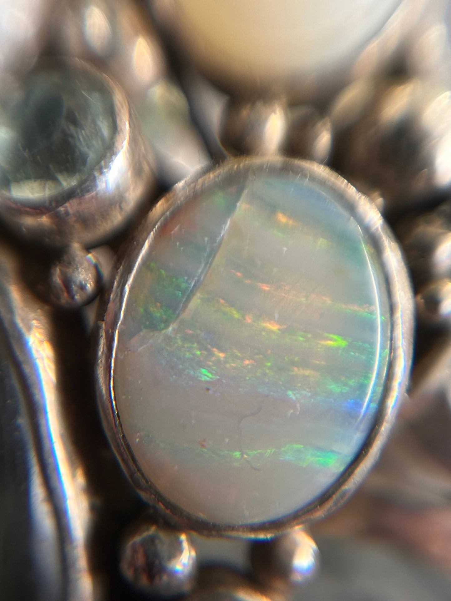 Spectacular Polish Artisan Double-Finger Ring.
Sterling Silver, Rock Crystal, Topaz, Opals, Aquamarine & Pearls.