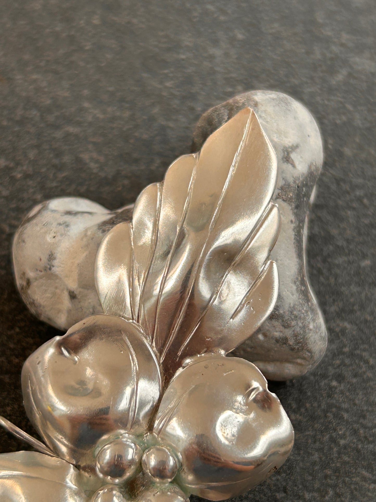A rare sterling silver dogwood flower pendant from John Wanamaker.