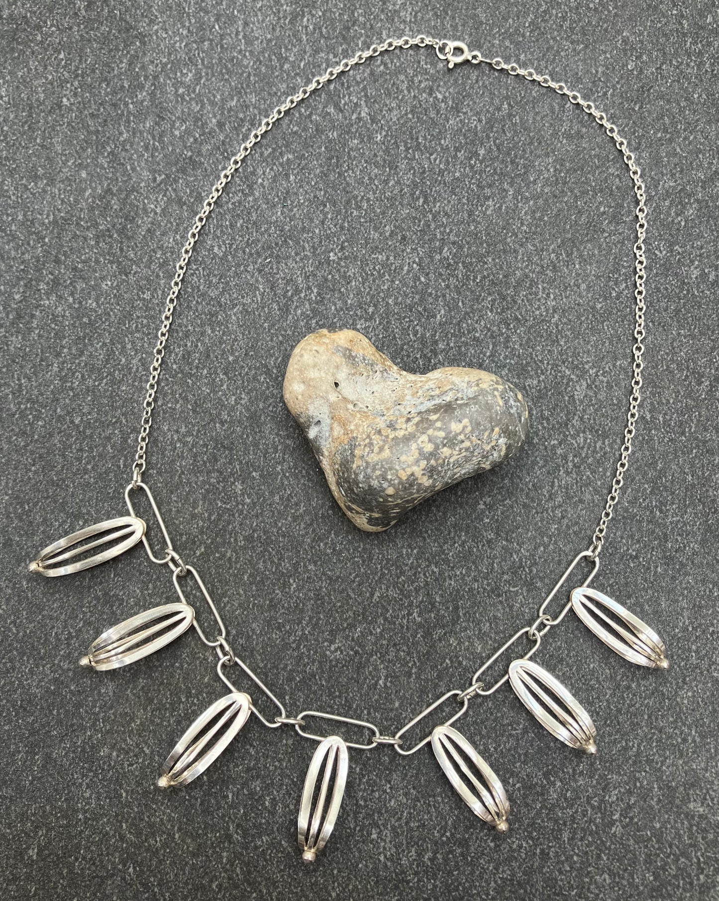 Artisan sterling silver sculptural necklace.