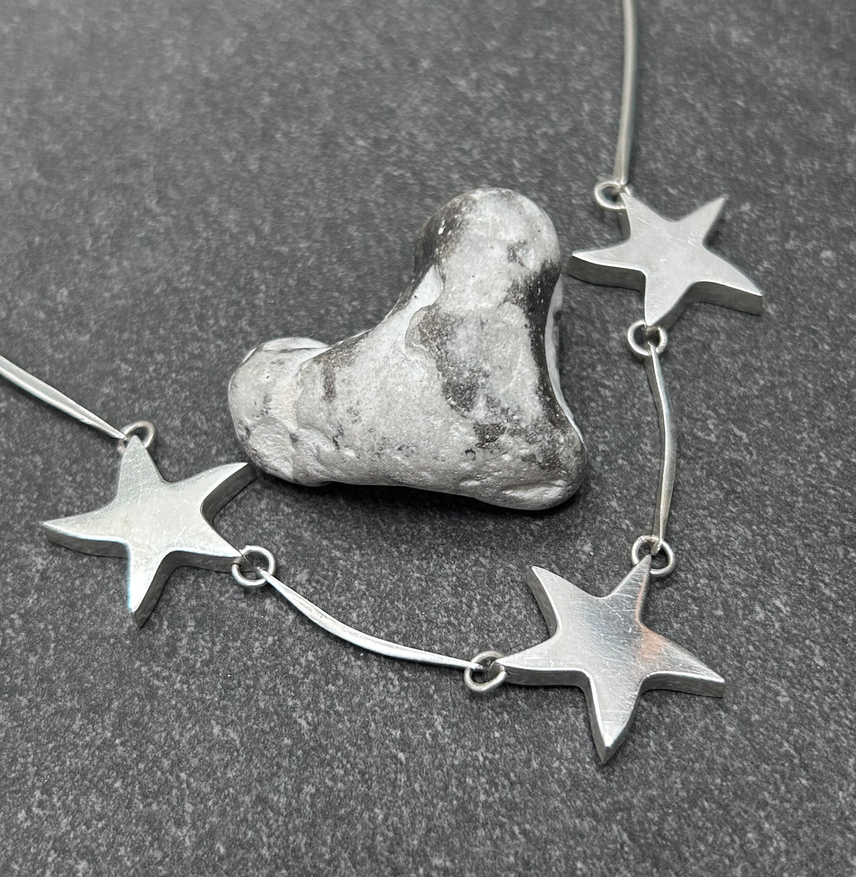 Wonderfully sculptural vintage sterling silver star necklace