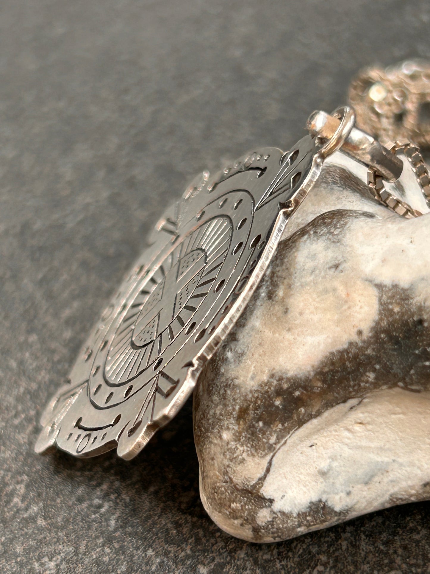 A captivating vintage sterling silver bohemian pendant featuring the ancient sun cross