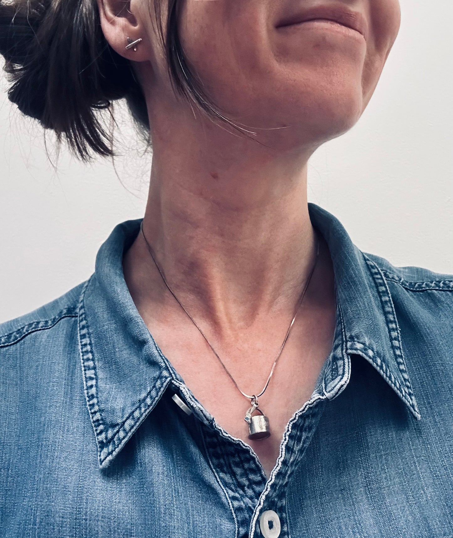 Pendant beautifully crafted in the shape of a painter’s paint pot and brush