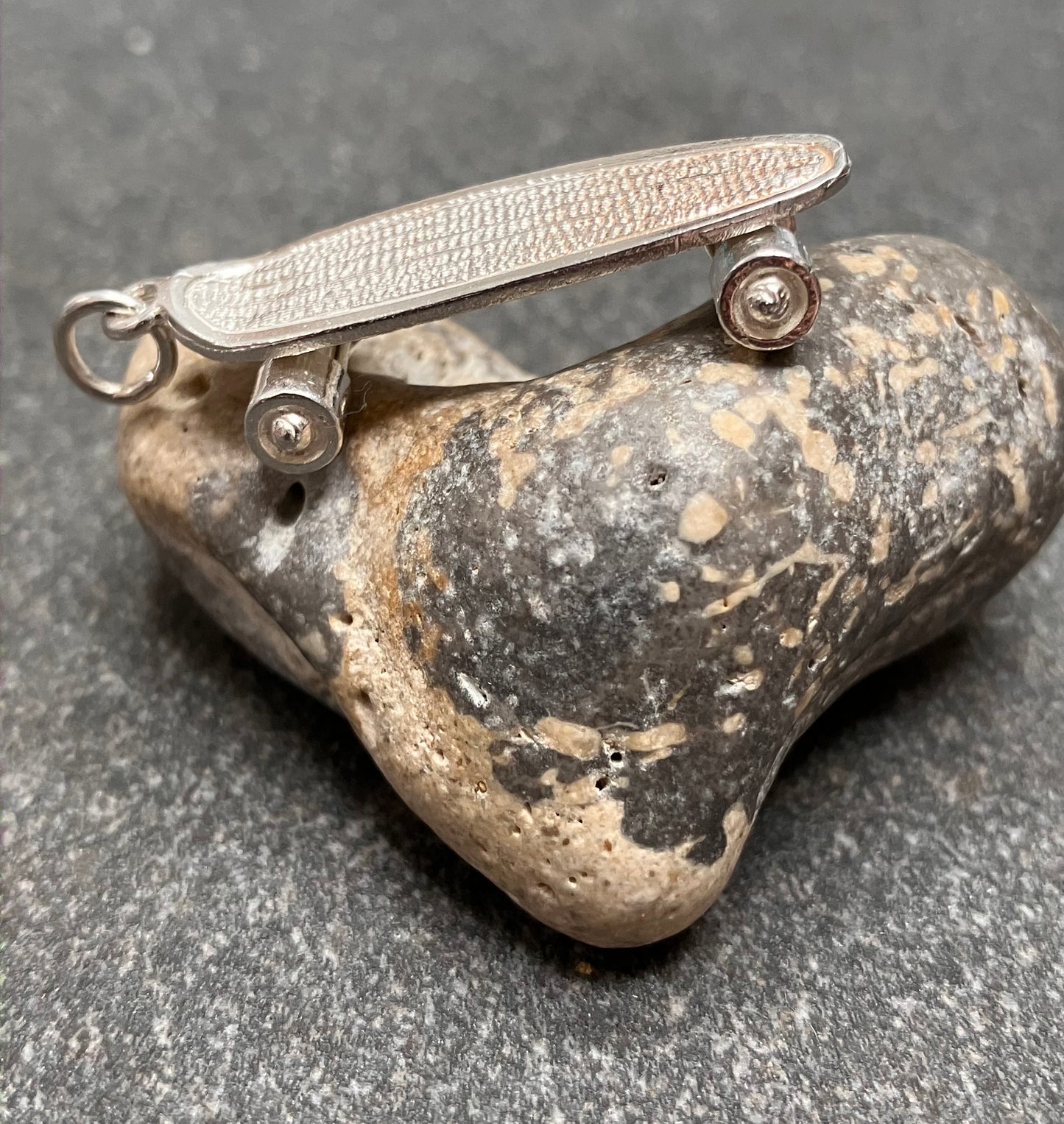 Vintage sterling silver skateboard pendant.