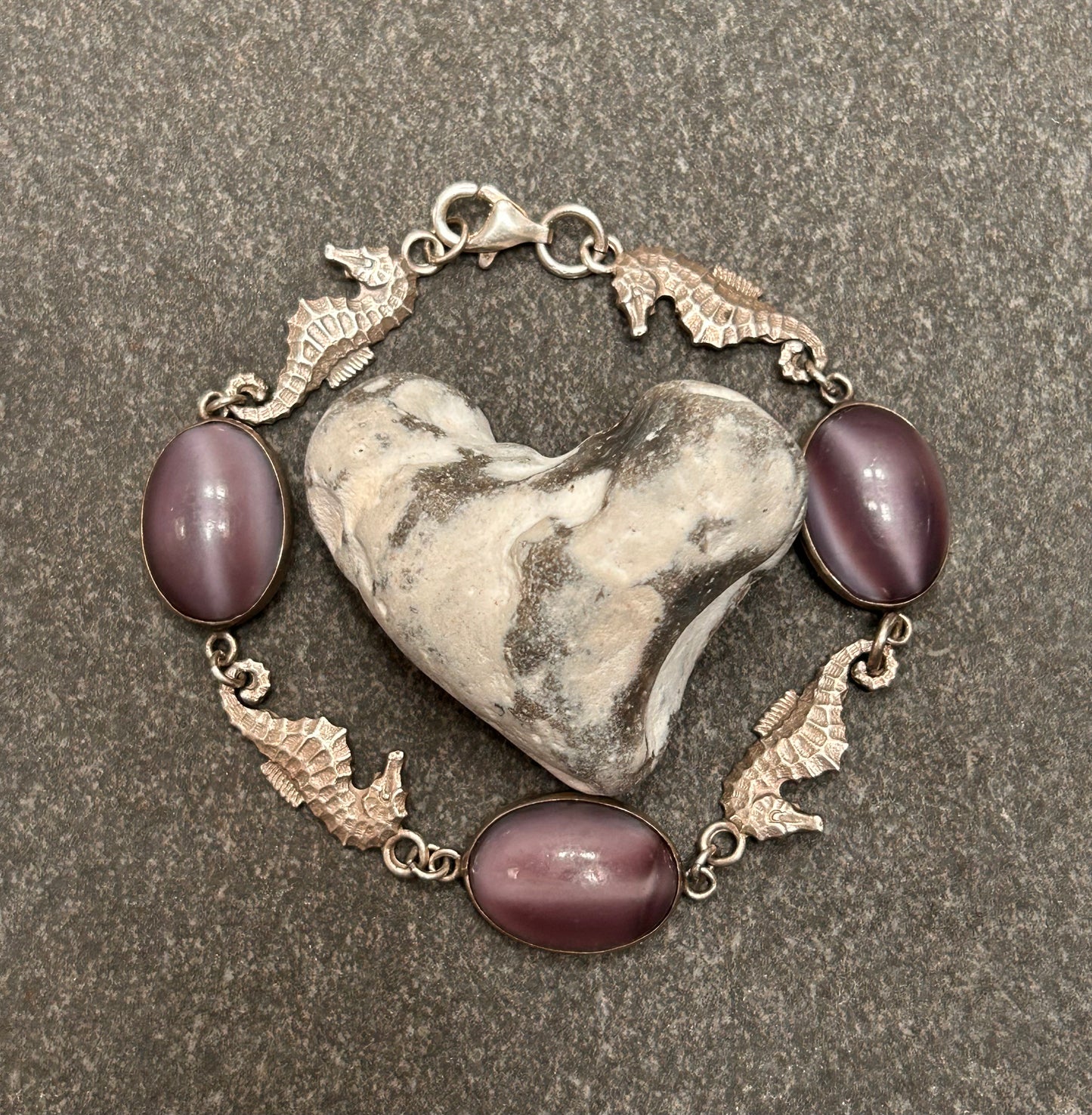 A truly enchanting vintage sterling silver bracelet, featuring four exquisitely detailed seahorses
