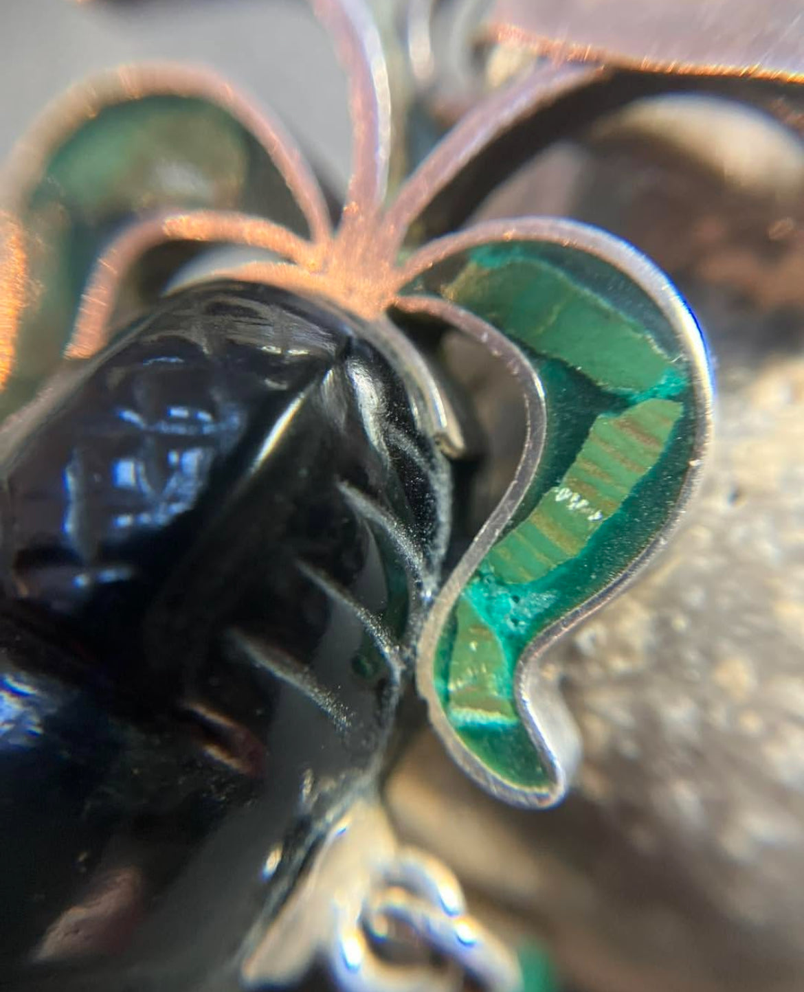 A striking vintage Mexican warrior face pendant crafted in sterling silver.