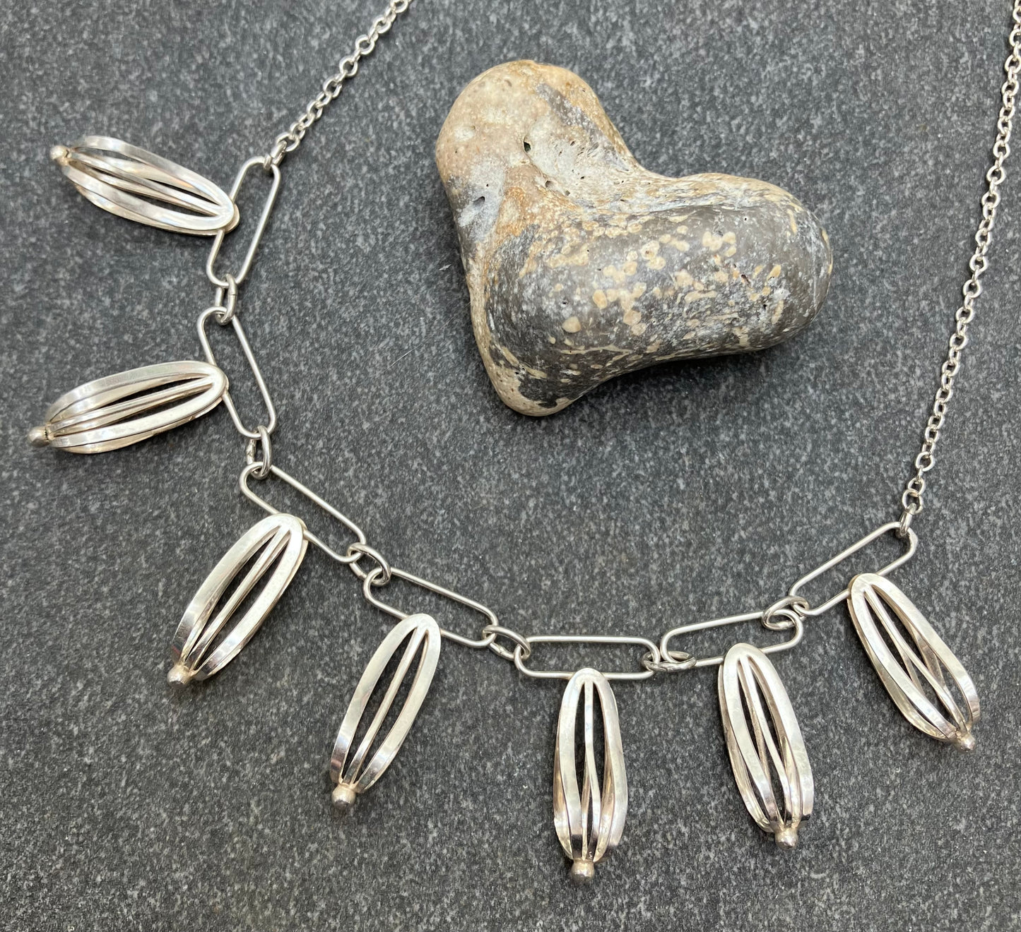 Artisan sterling silver sculptural necklace.