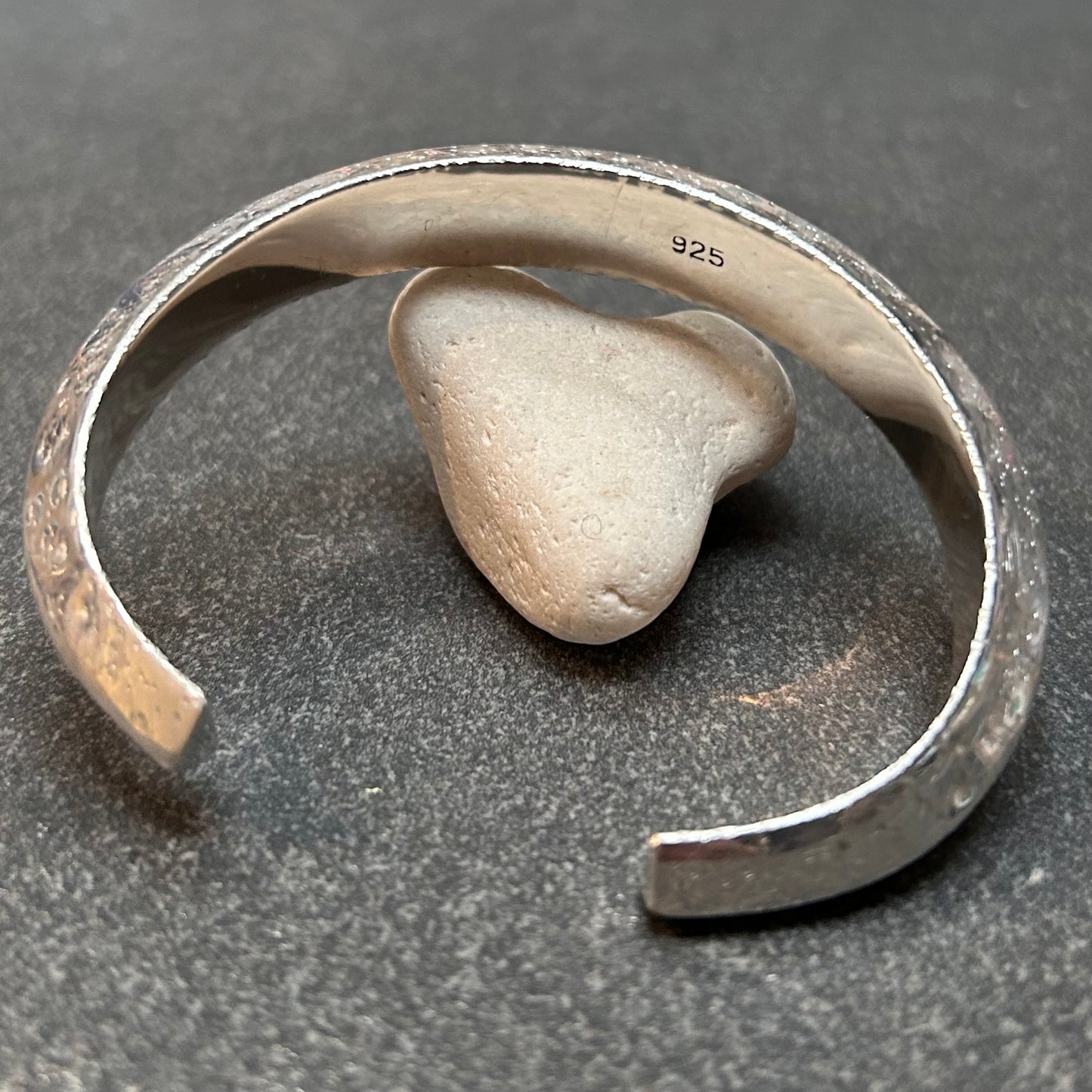 This vintage sterling silver artisan bangle is a one-off piece, alive with texture and character.