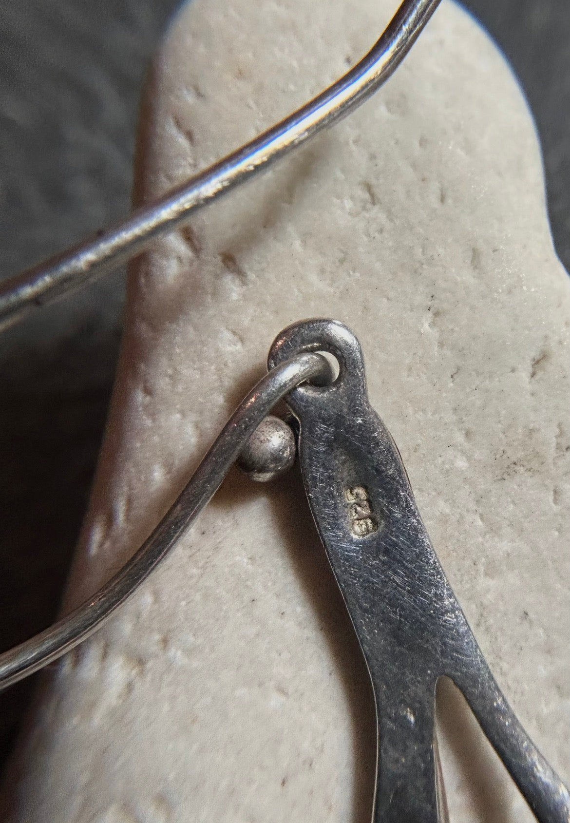 Vintage sterling silver artisan earrings with a graceful organic form.