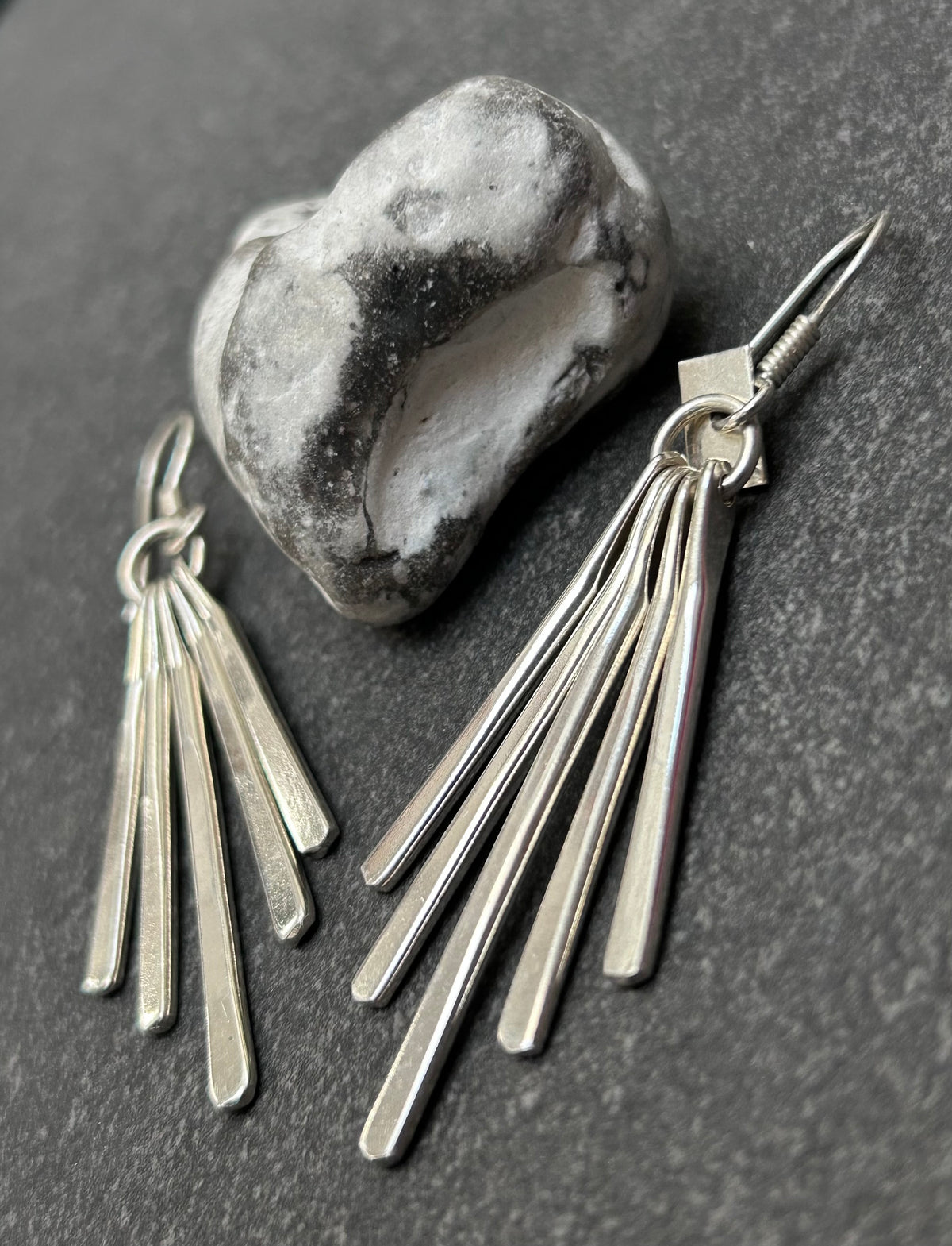 Mexican sterling silver earrings featuring slender bars.