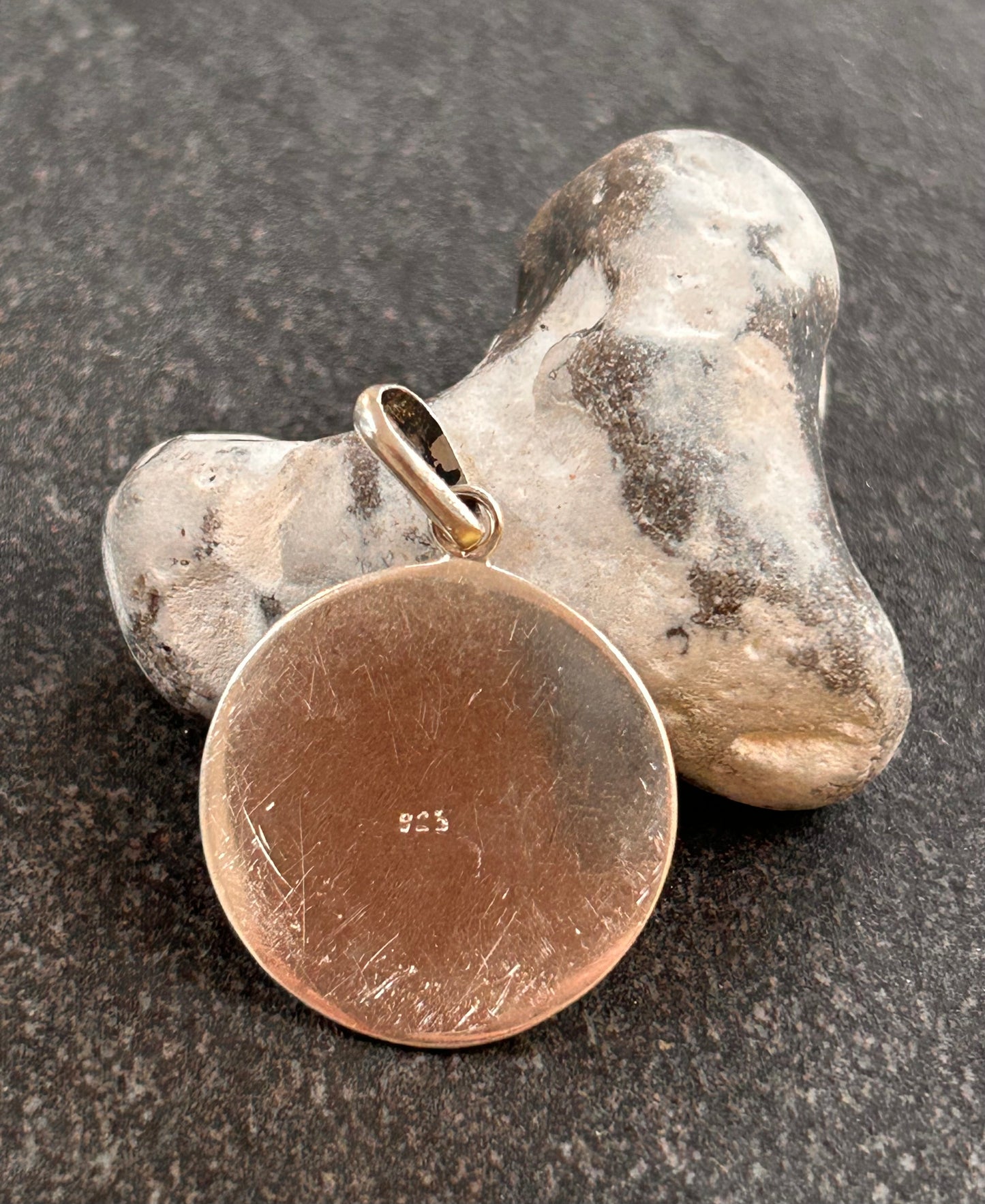 A striking vintage sterling silver circular pendant