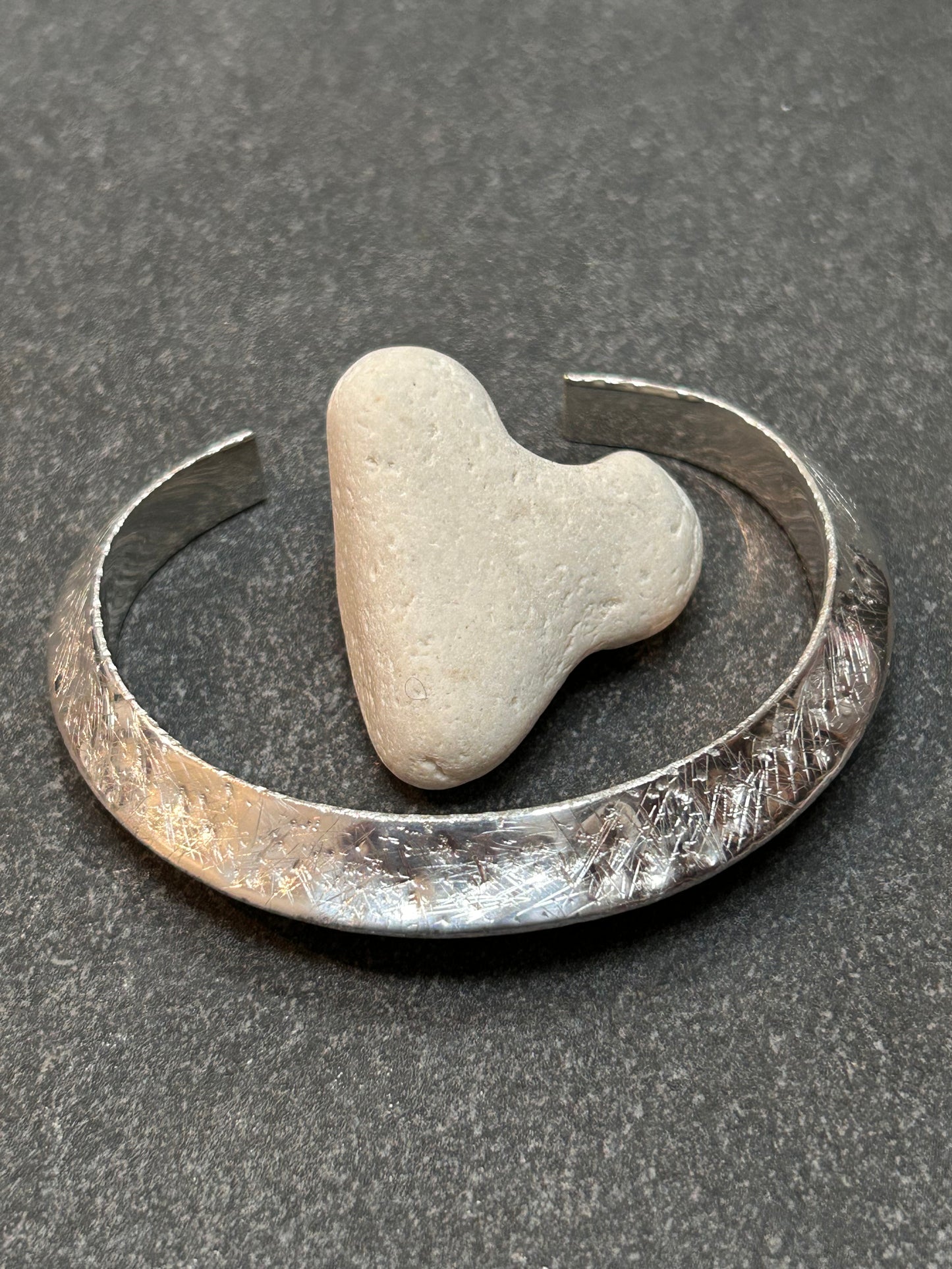 This vintage sterling silver artisan bangle is a one-off piece, alive with texture and character.