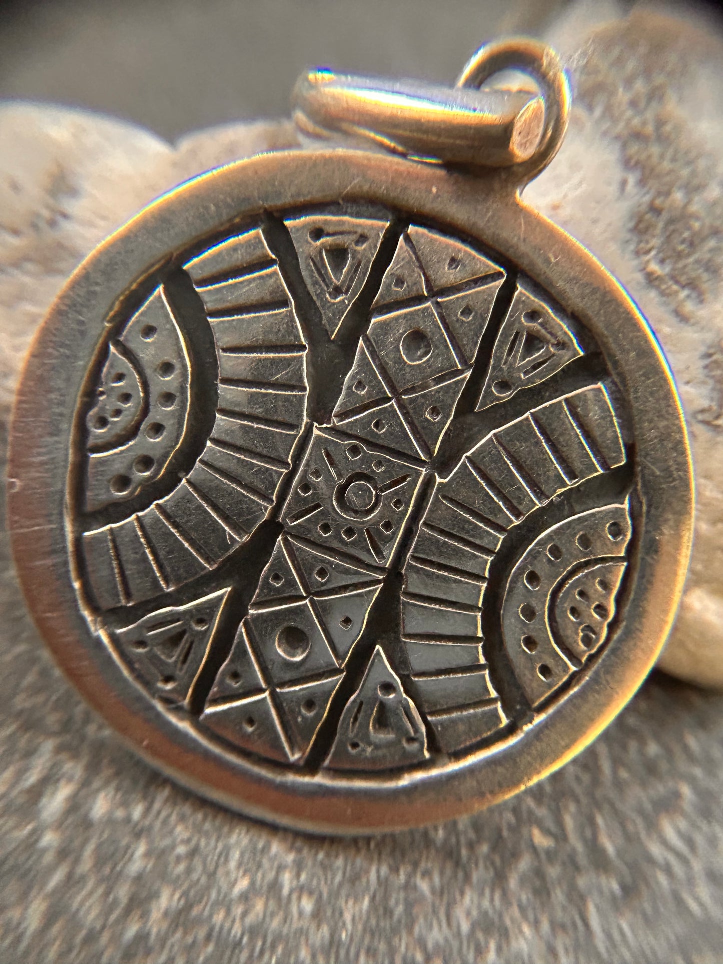 A beautifully crafted vintage sterling silver circular pendant