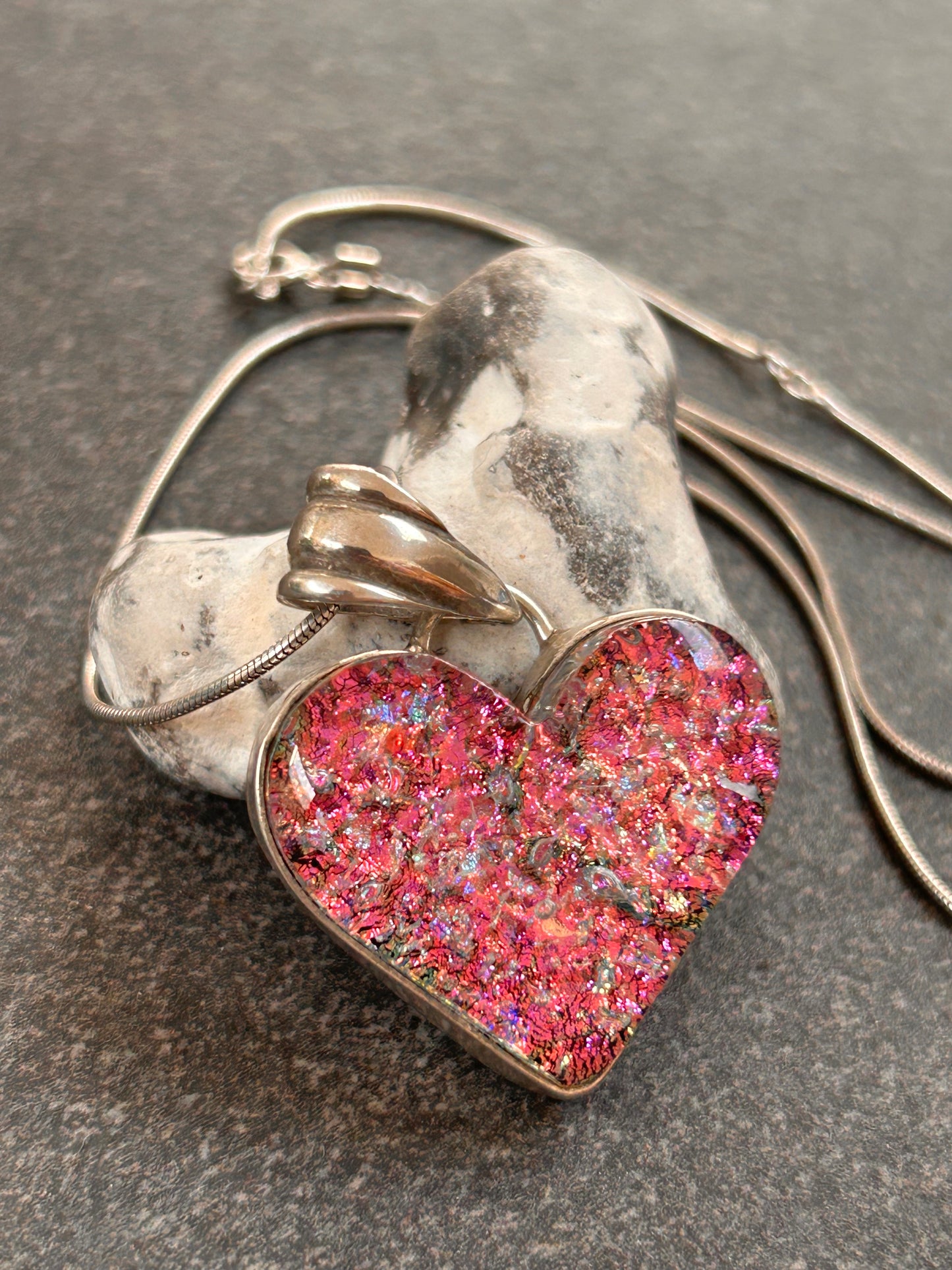 A beautiful vintage sterling silver and dichroic glass heart pendant