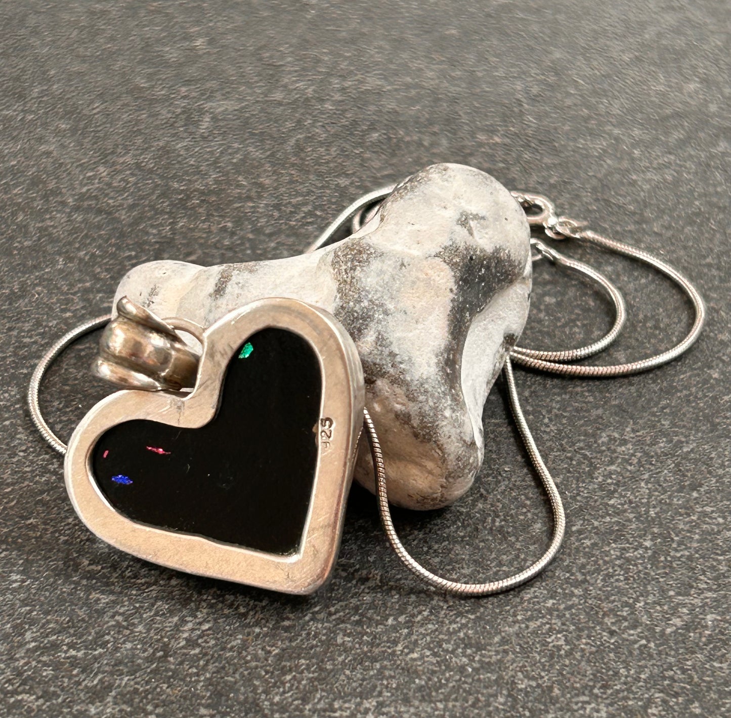 A beautiful vintage sterling silver and dichroic glass heart pendant