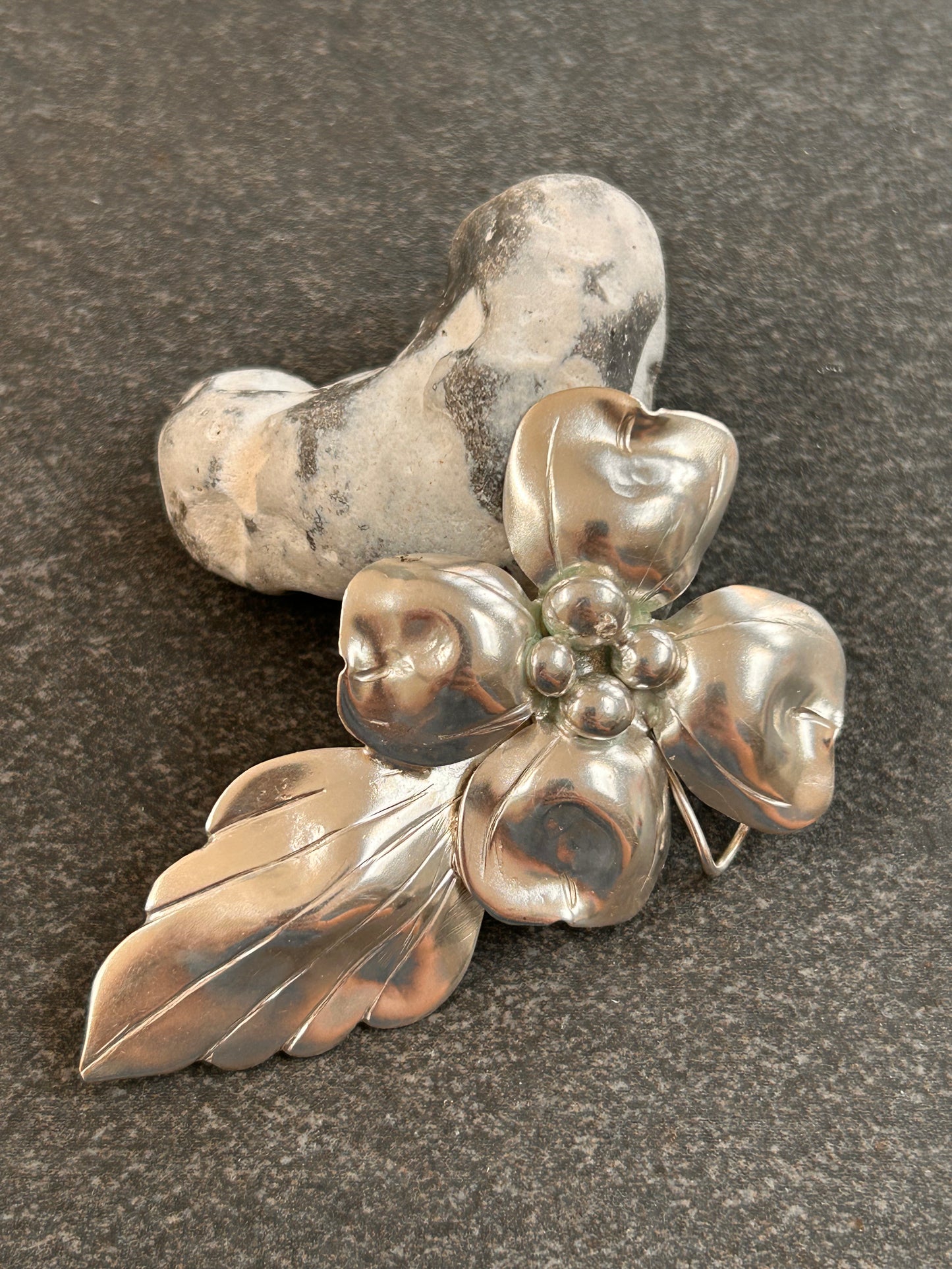 A rare sterling silver dogwood flower pendant from John Wanamaker.