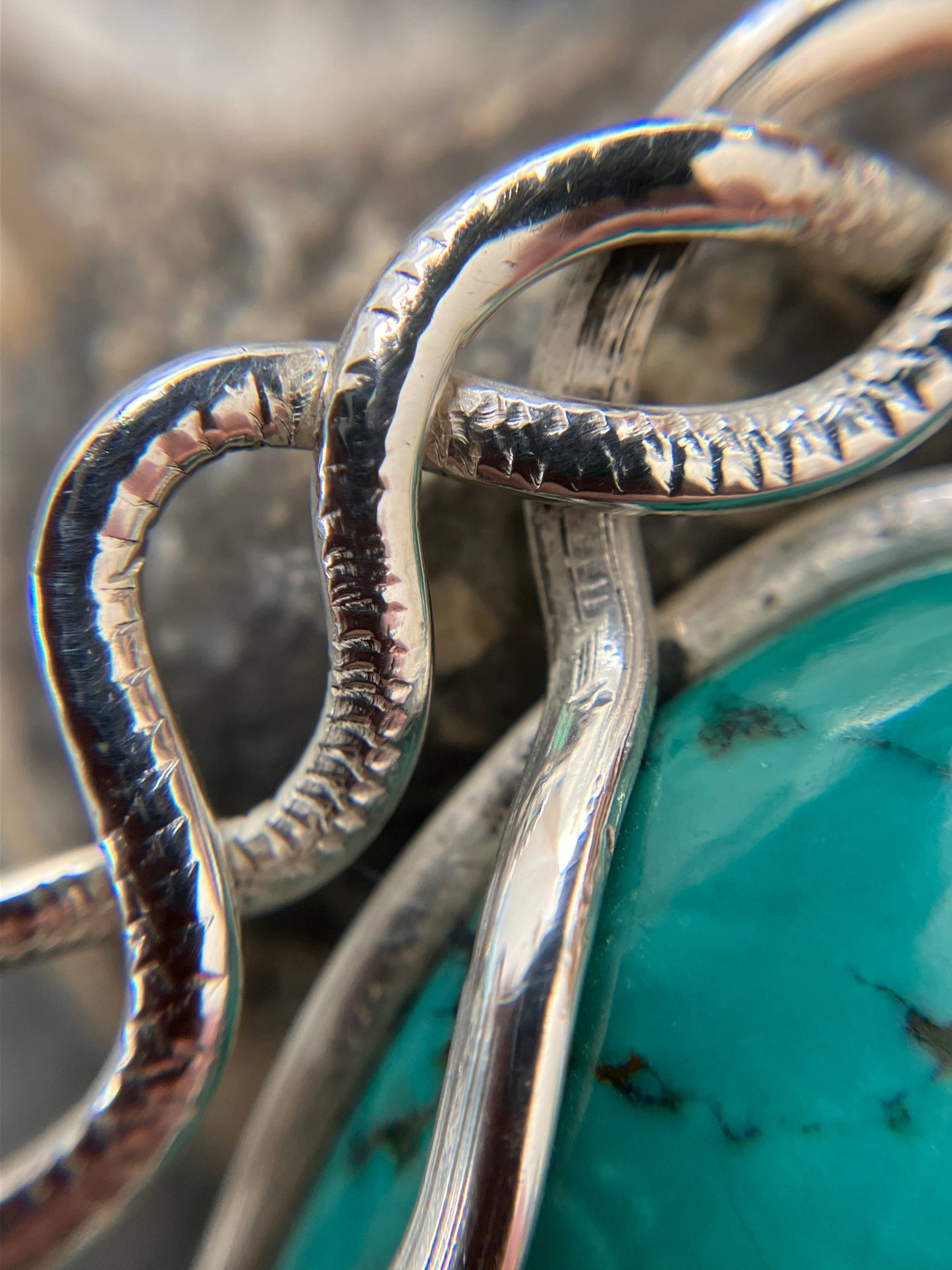 Artisan vintage sterling silver intertwining snake pendant with a piece of Turqurenite in the centre.