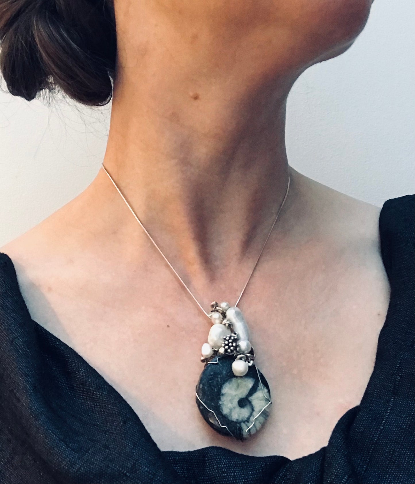 Unique handmade ammonite fossil, pearl and silver pendant.