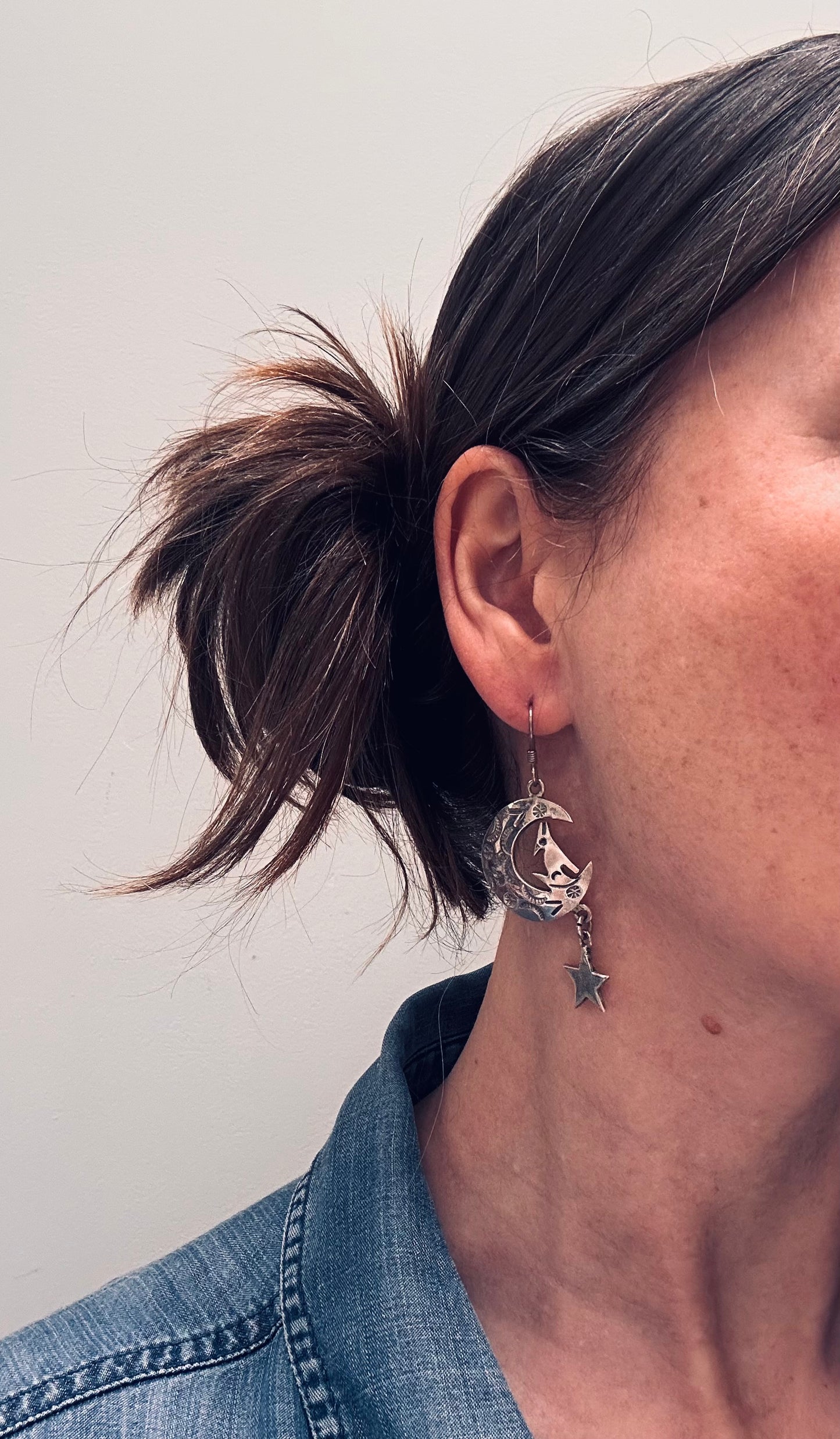 Fantastic vintage sterling silver Mexican earrings featuring a wonderfully whimsical celestial design of a howling wolf nestled within a crescent moon