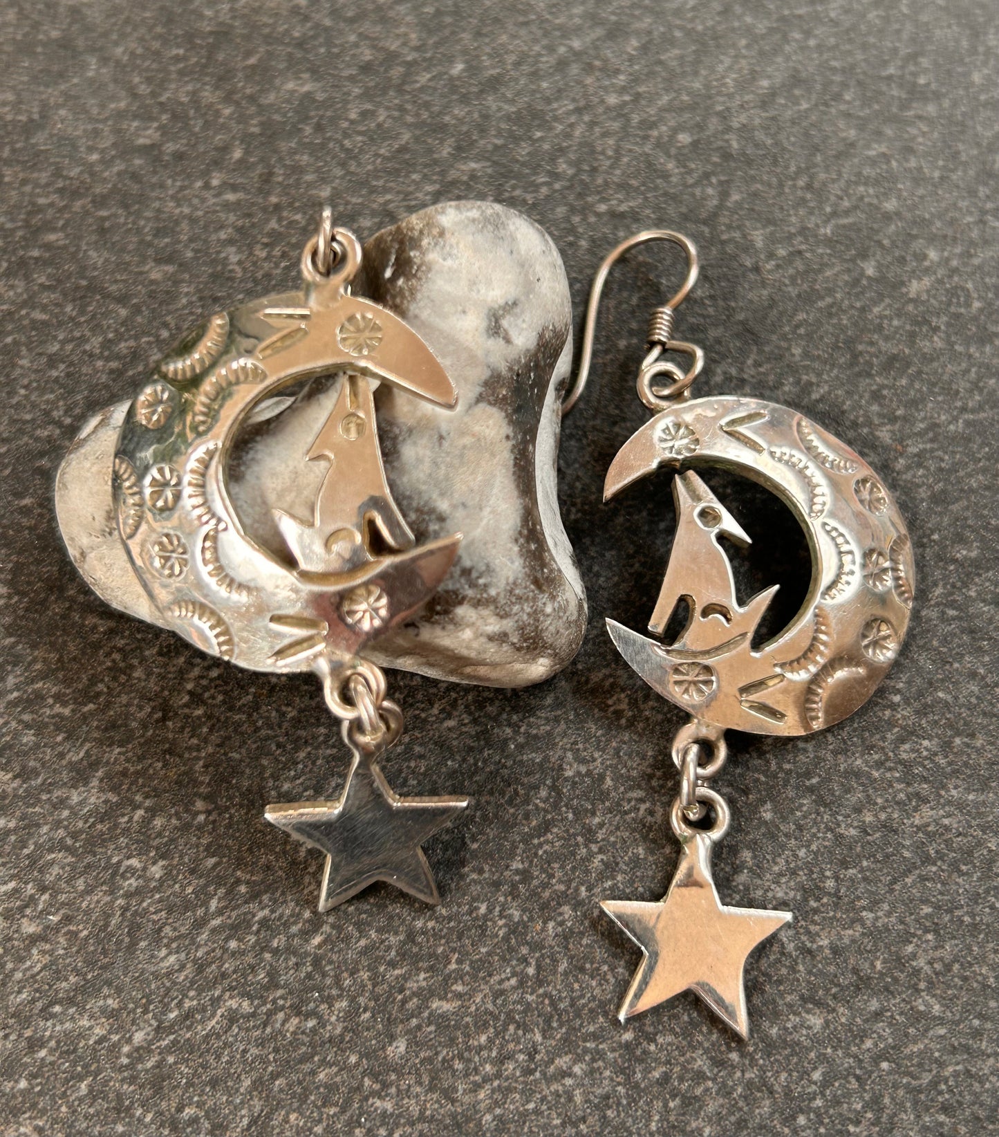 Fantastic vintage sterling silver Mexican earrings featuring a wonderfully whimsical celestial design of a howling wolf nestled within a crescent moon
