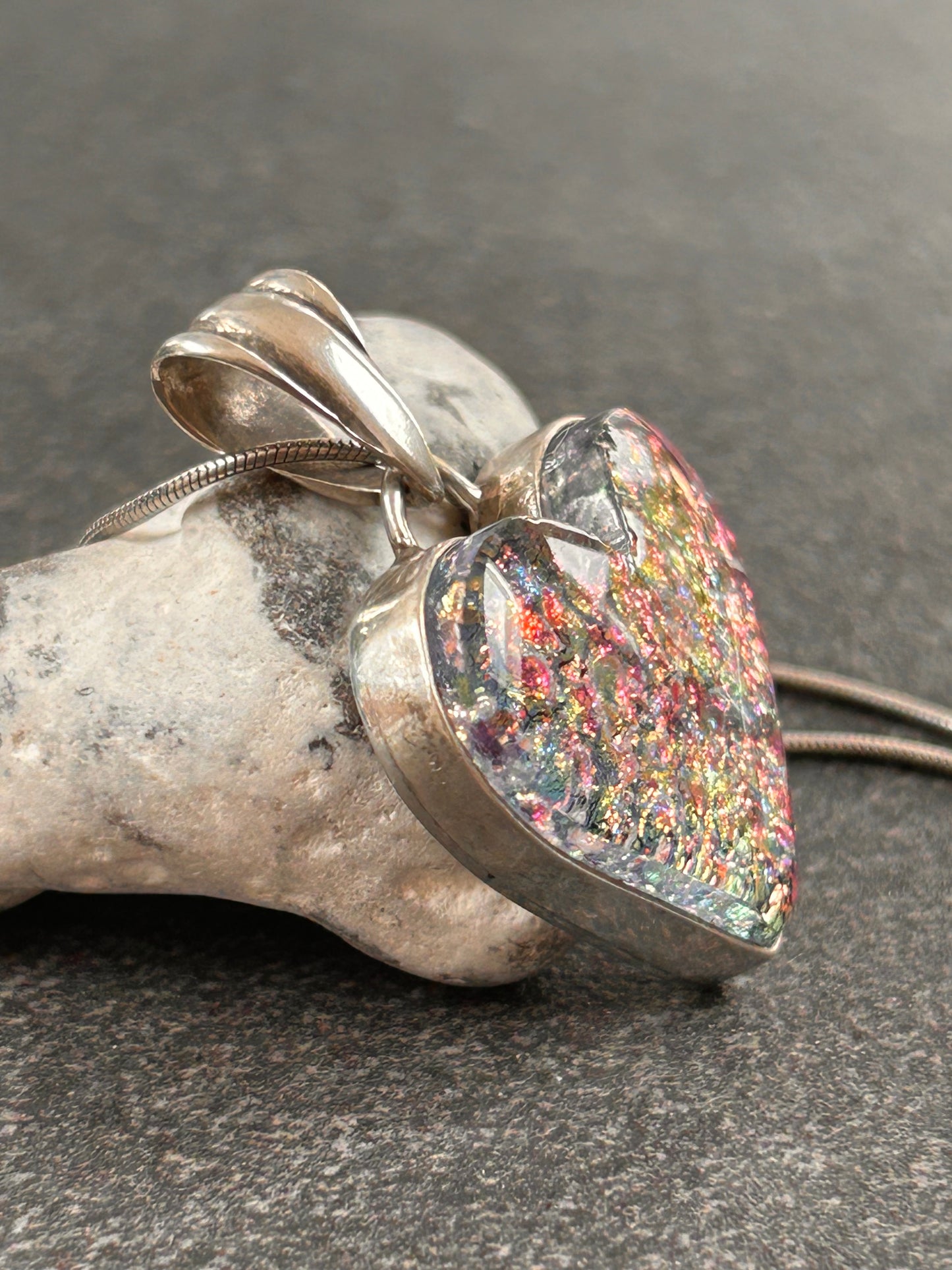 A beautiful vintage sterling silver and dichroic glass heart pendant