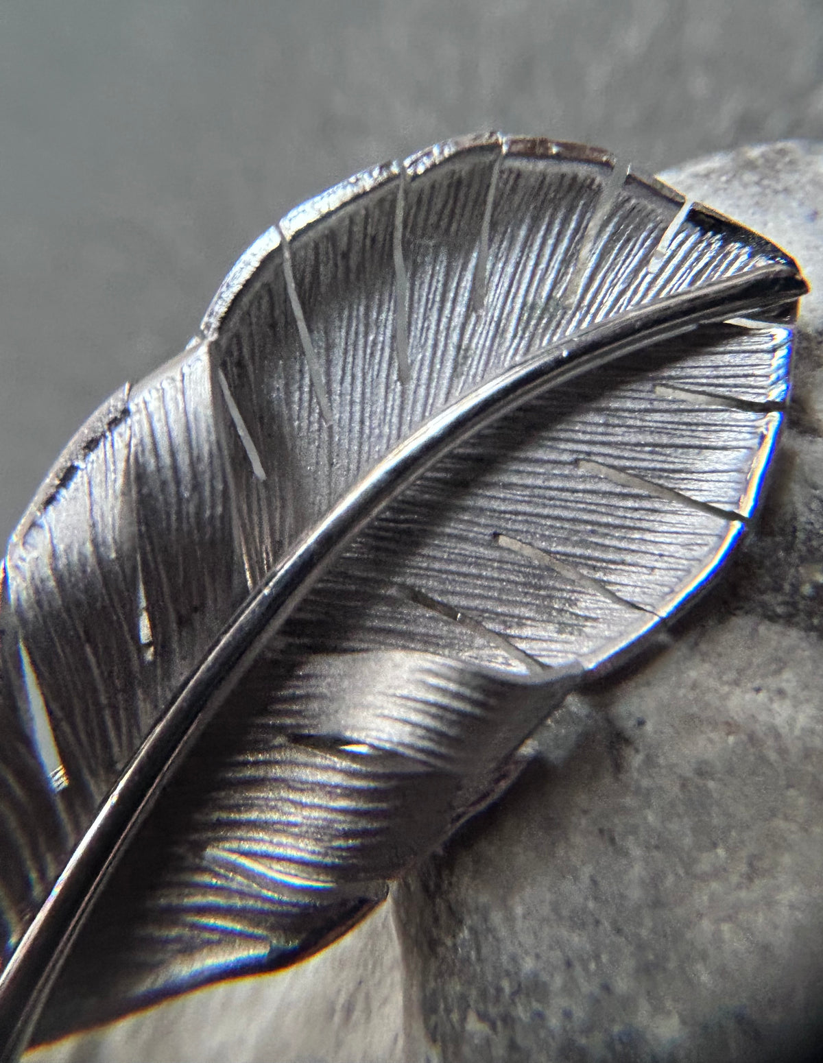 A beautiful pair of vintage screw on sterling silver feather earrings