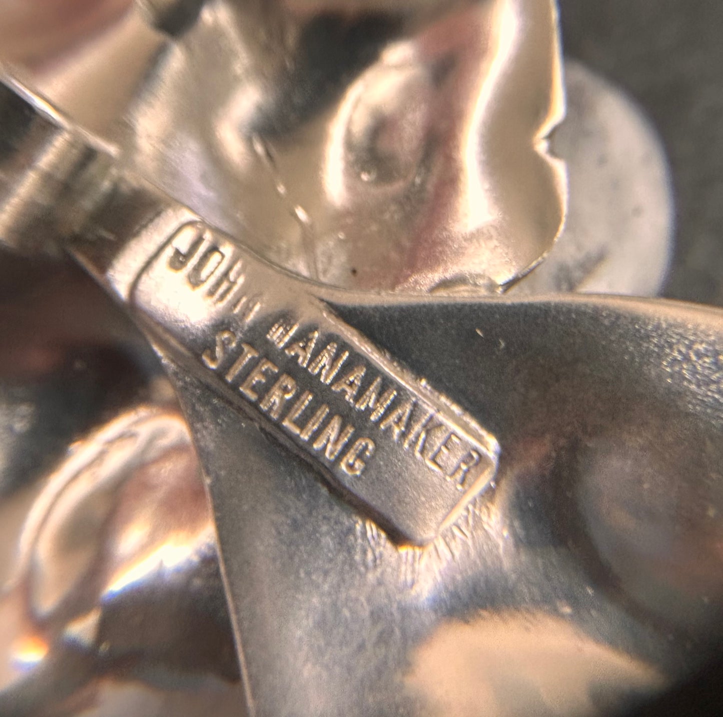A rare sterling silver dogwood flower pendant from John Wanamaker.