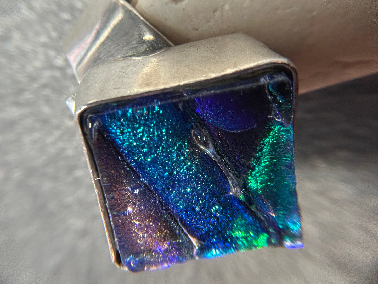 Vibrant vintage sterling silver dichroic glass ring.