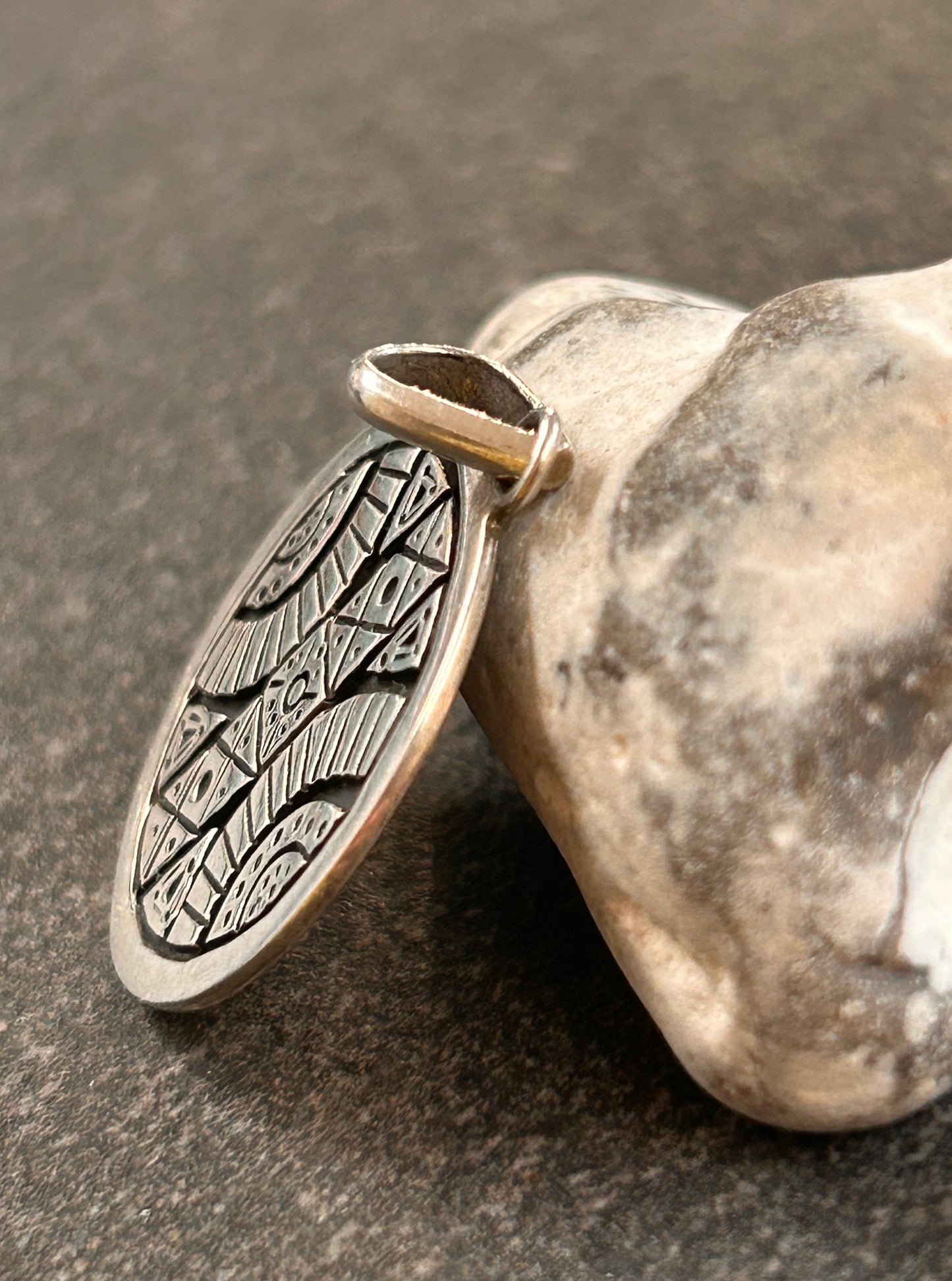 A beautifully crafted vintage sterling silver circular pendant