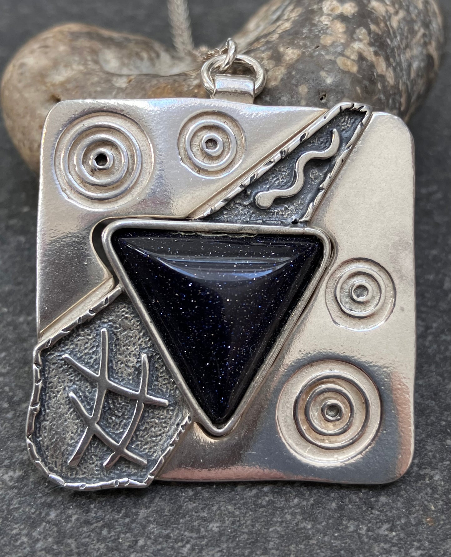 Vintage sterling silver pendant set with Blue goldstone.