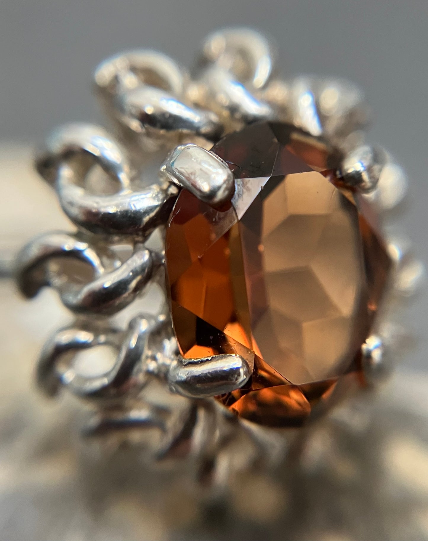 Vintage sterling silver ring set with a mandarin garnet cut stone