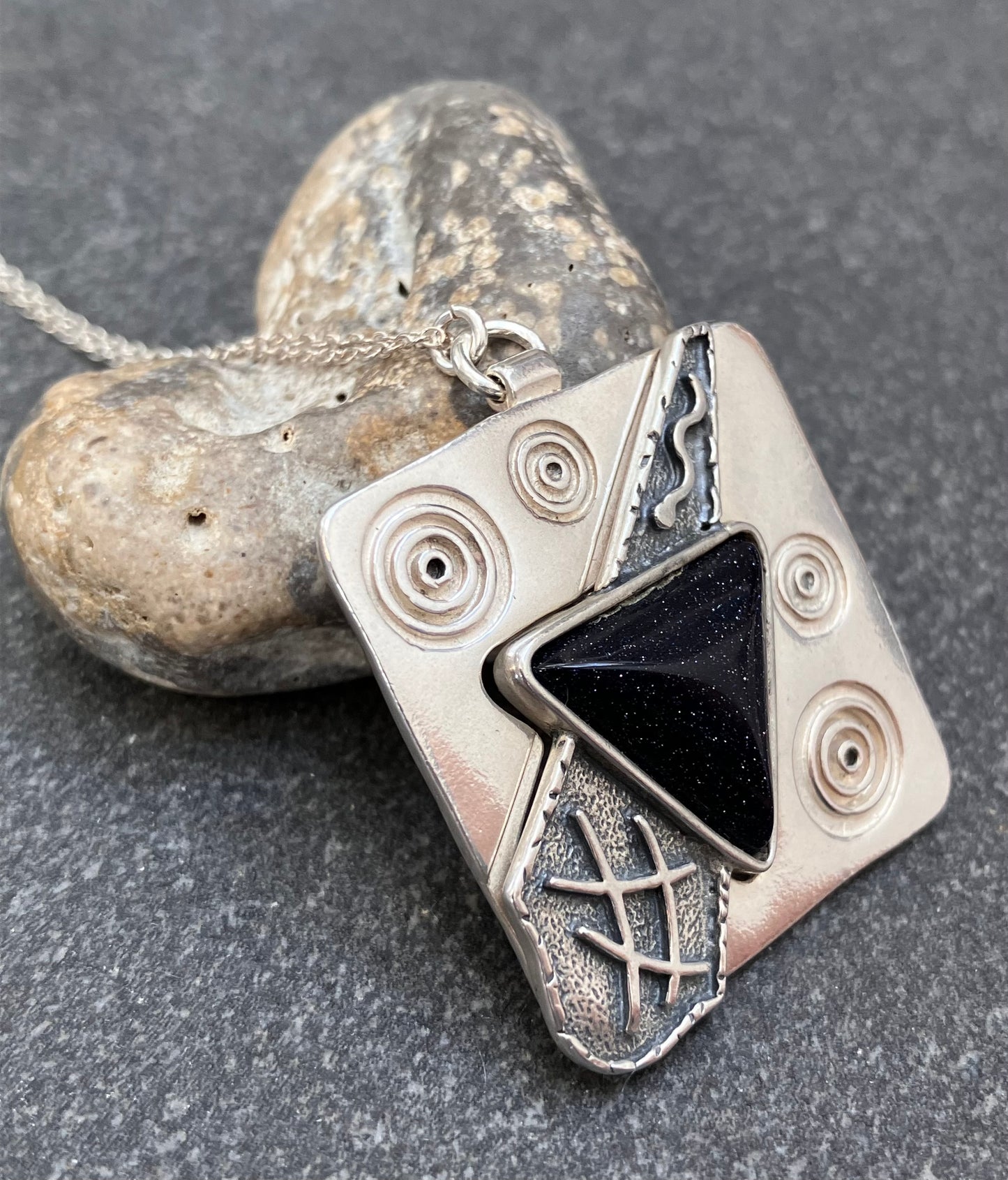 Vintage sterling silver pendant set with Blue goldstone.