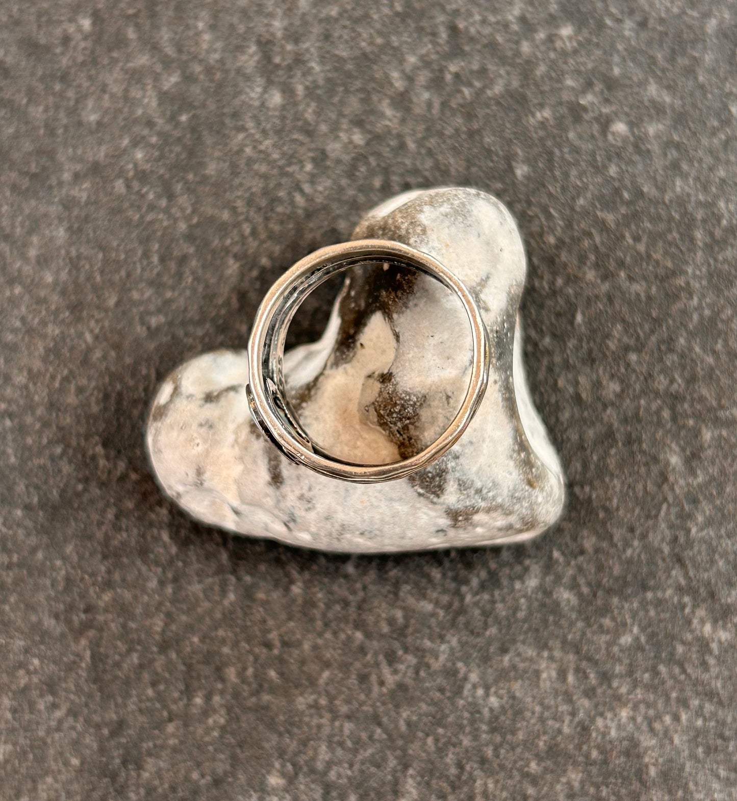 Vintage sterling silver artisan ring featuring a captivating lab-created opal