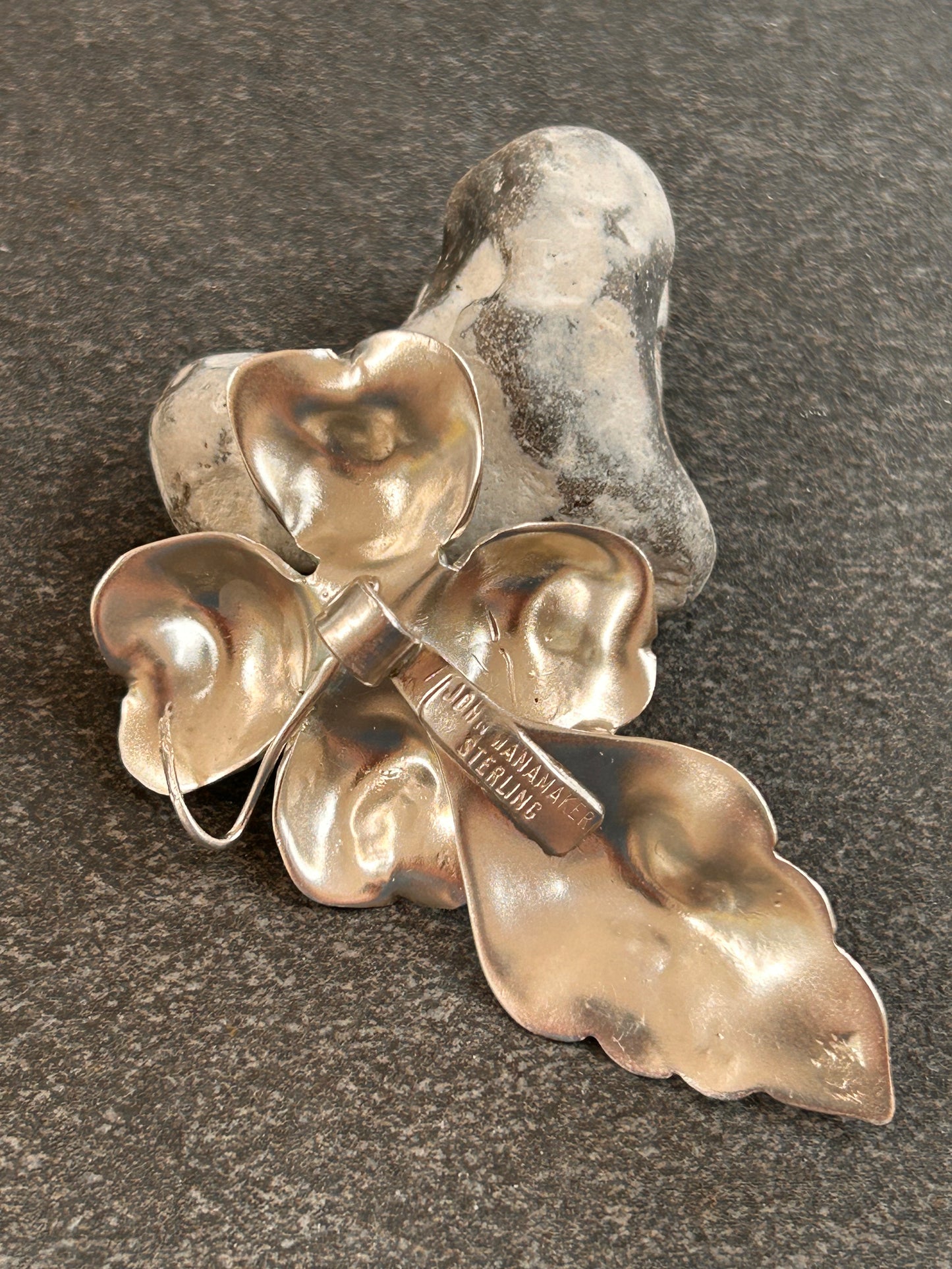 A rare sterling silver dogwood flower pendant from John Wanamaker.