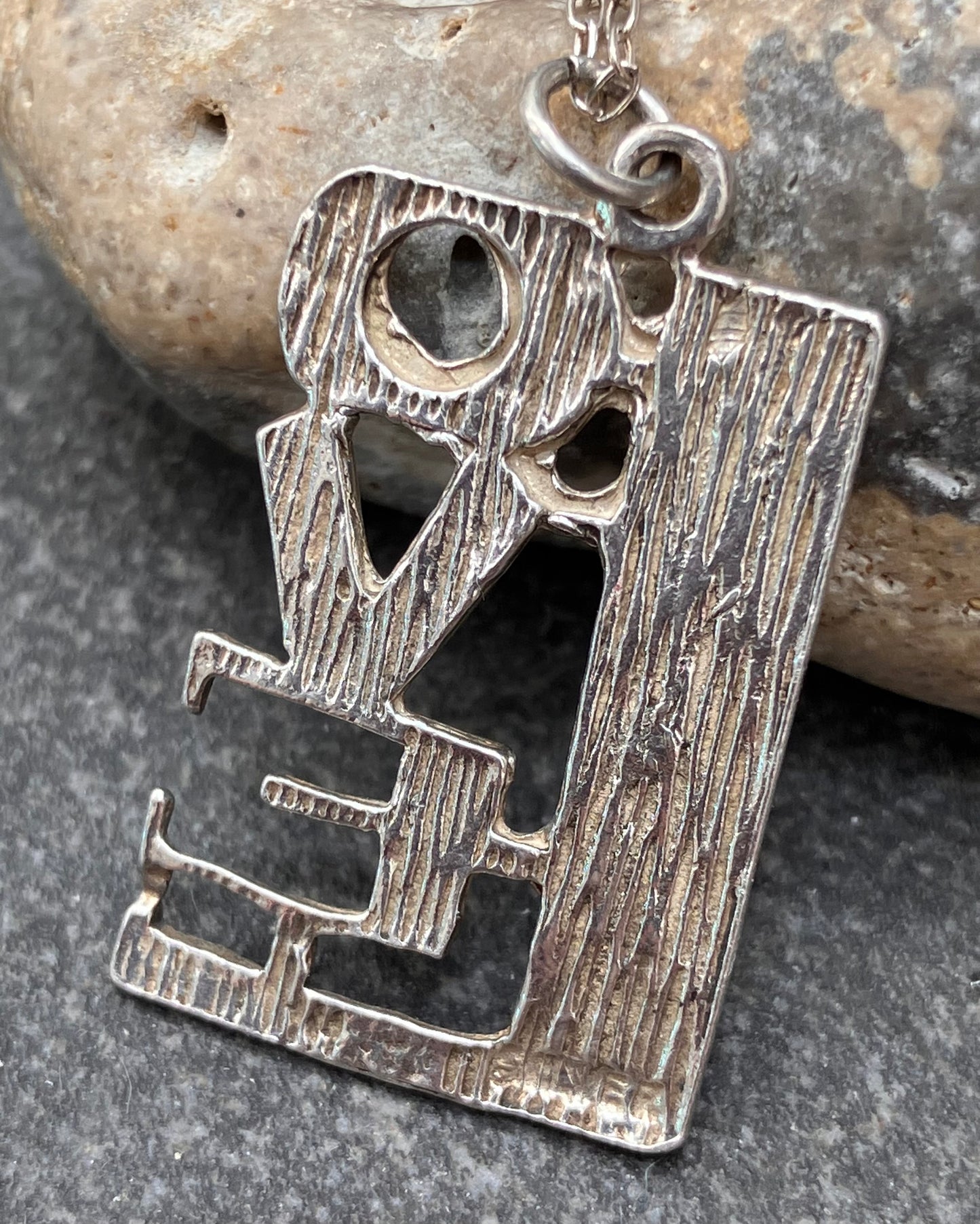 Vintage sterling silver LOVE pendant. Circa 1970’s