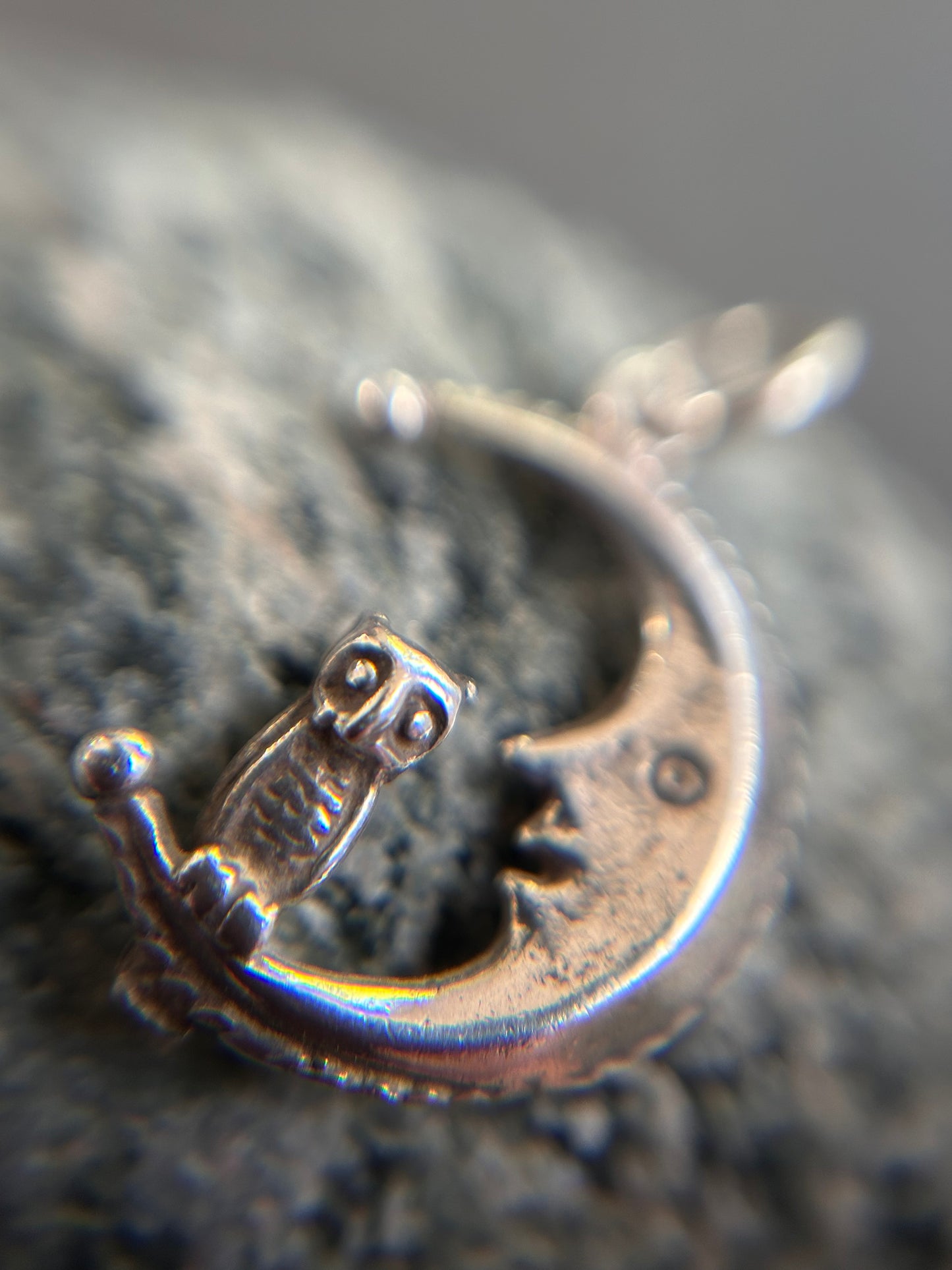 A beautifully whimsical vintage moon and owl pendant