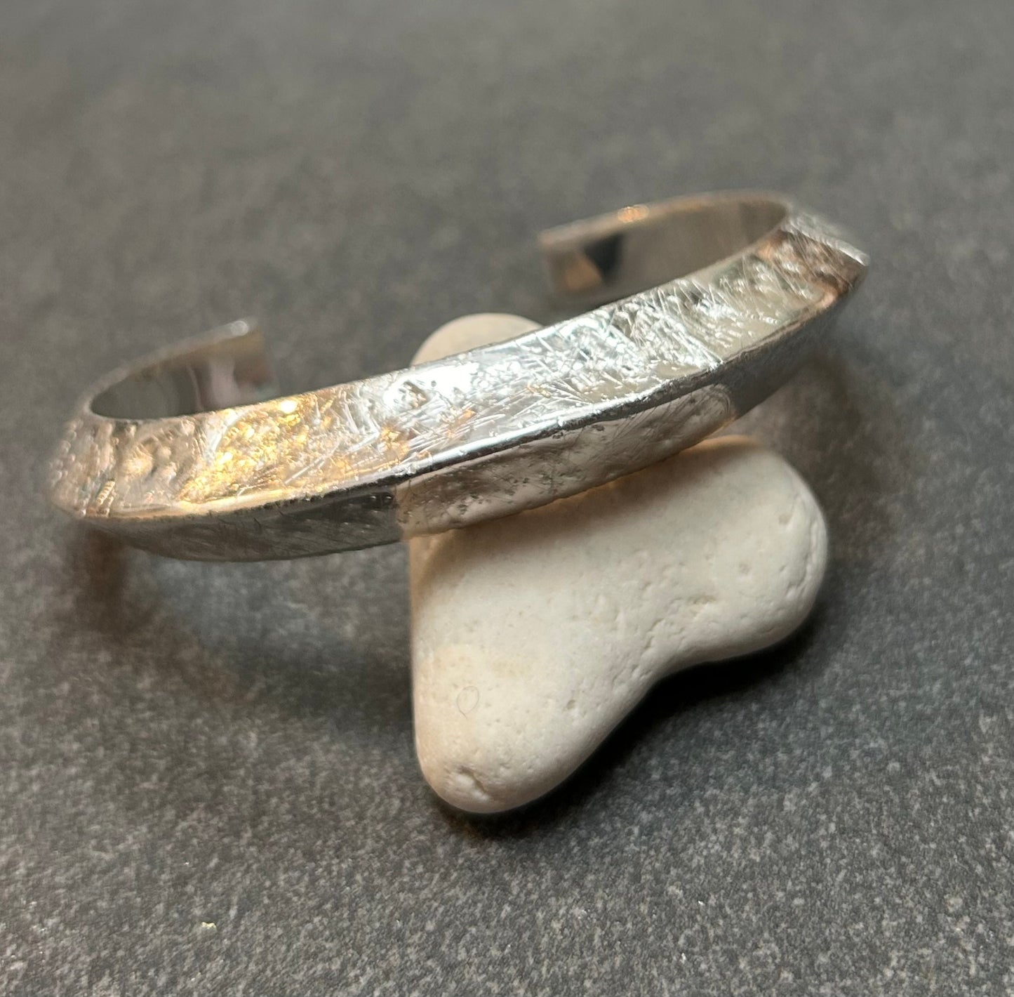 This vintage sterling silver artisan bangle is a one-off piece, alive with texture and character.