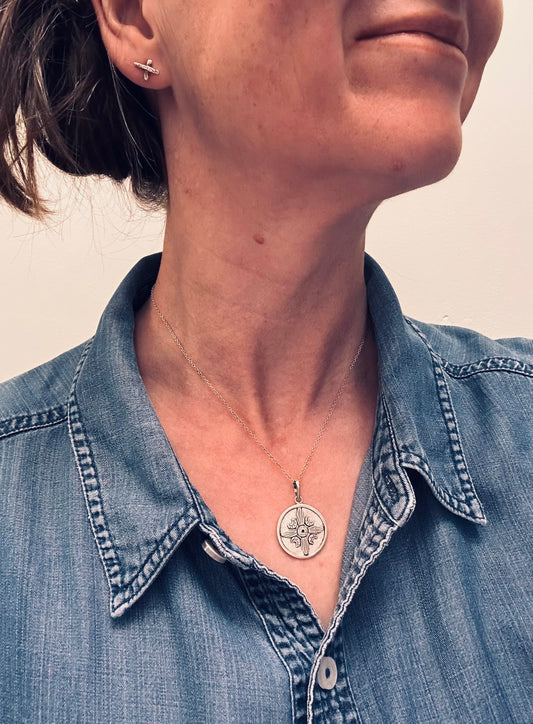 A striking vintage sterling silver circular pendant
