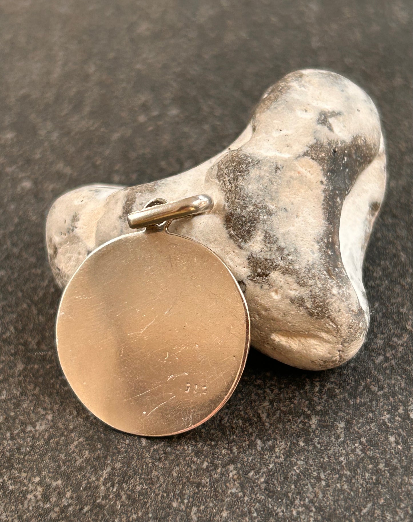 A beautifully crafted vintage sterling silver circular pendant