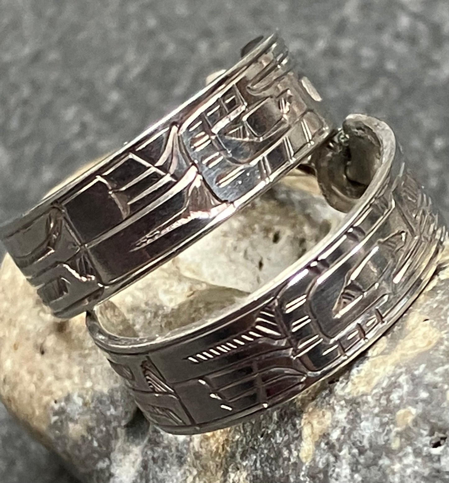 Vintage sterling silver hoops with all over intricate engraved pattern.