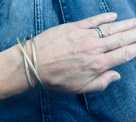Vintage sterling silver three inter locking bangles.