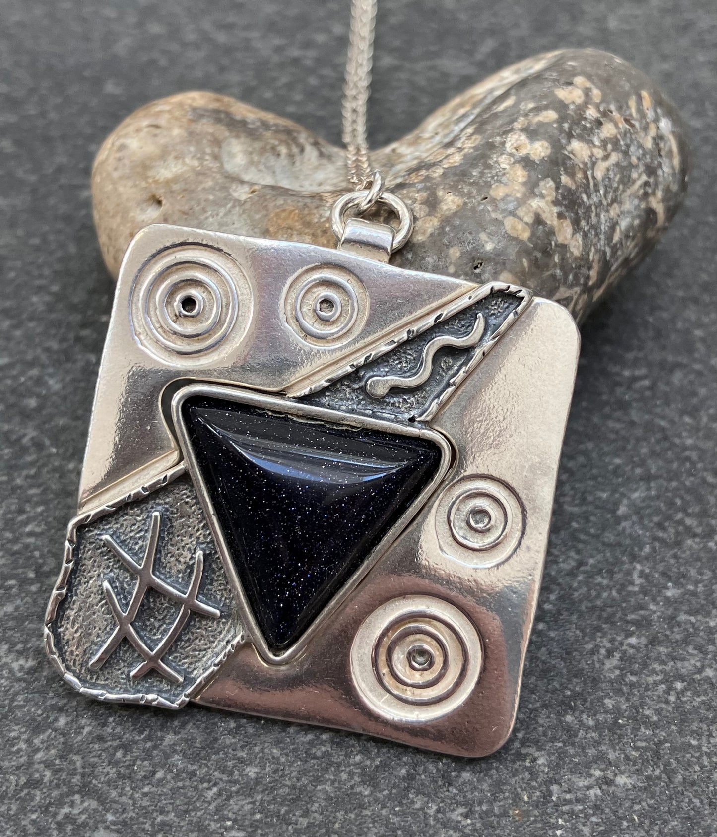 Vintage sterling silver pendant set with Blue goldstone.