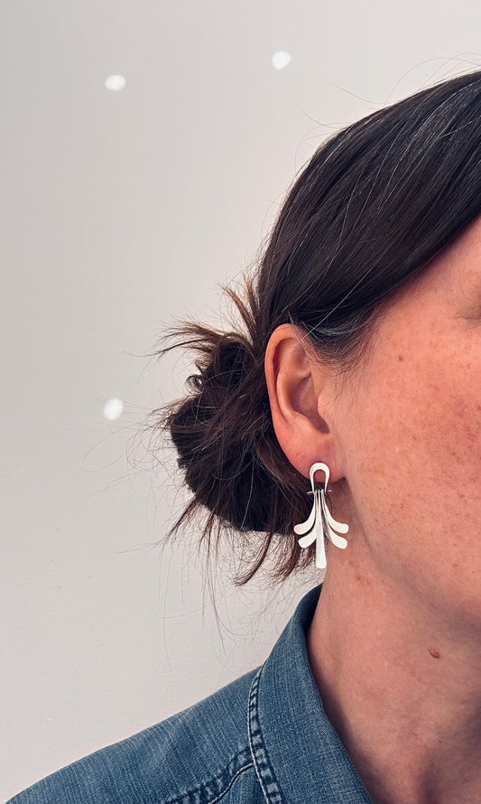 A striking pair of vintage sterling silver Mexican earrings
