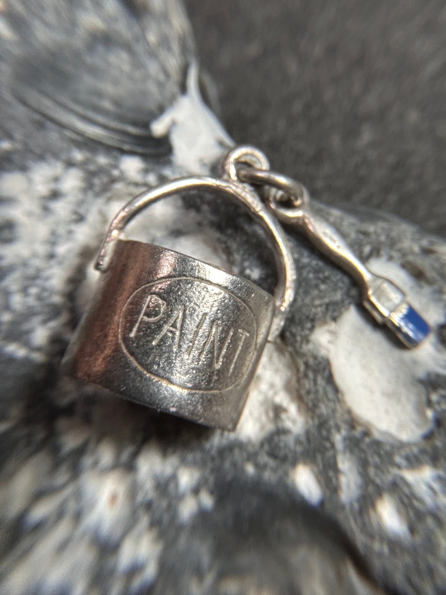 Pendant beautifully crafted in the shape of a painter’s paint pot and brush